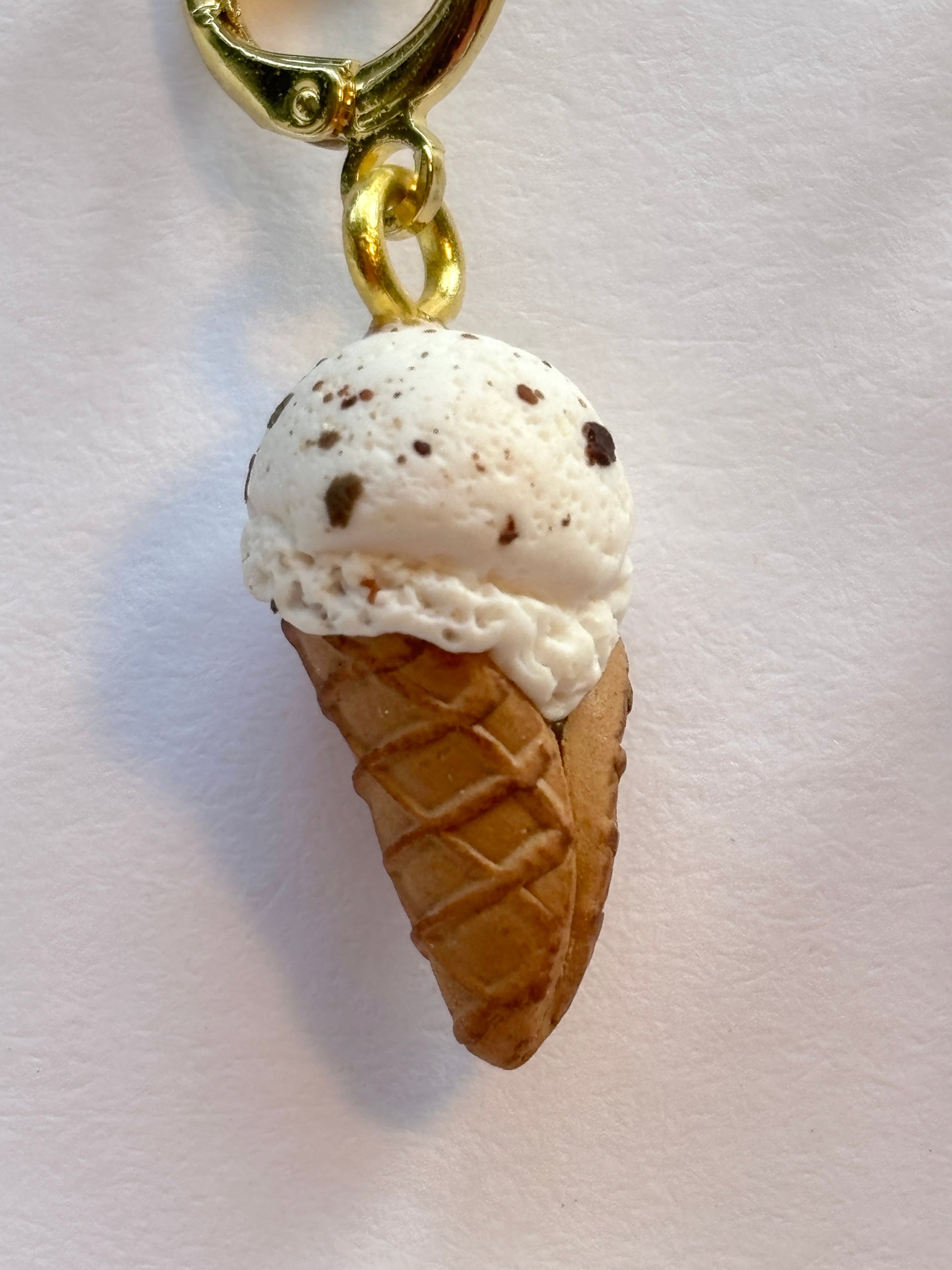 closeup shot of chocolate chip ice cream cone earring detailed miniature polymer clay jewelry unique summer food dangle