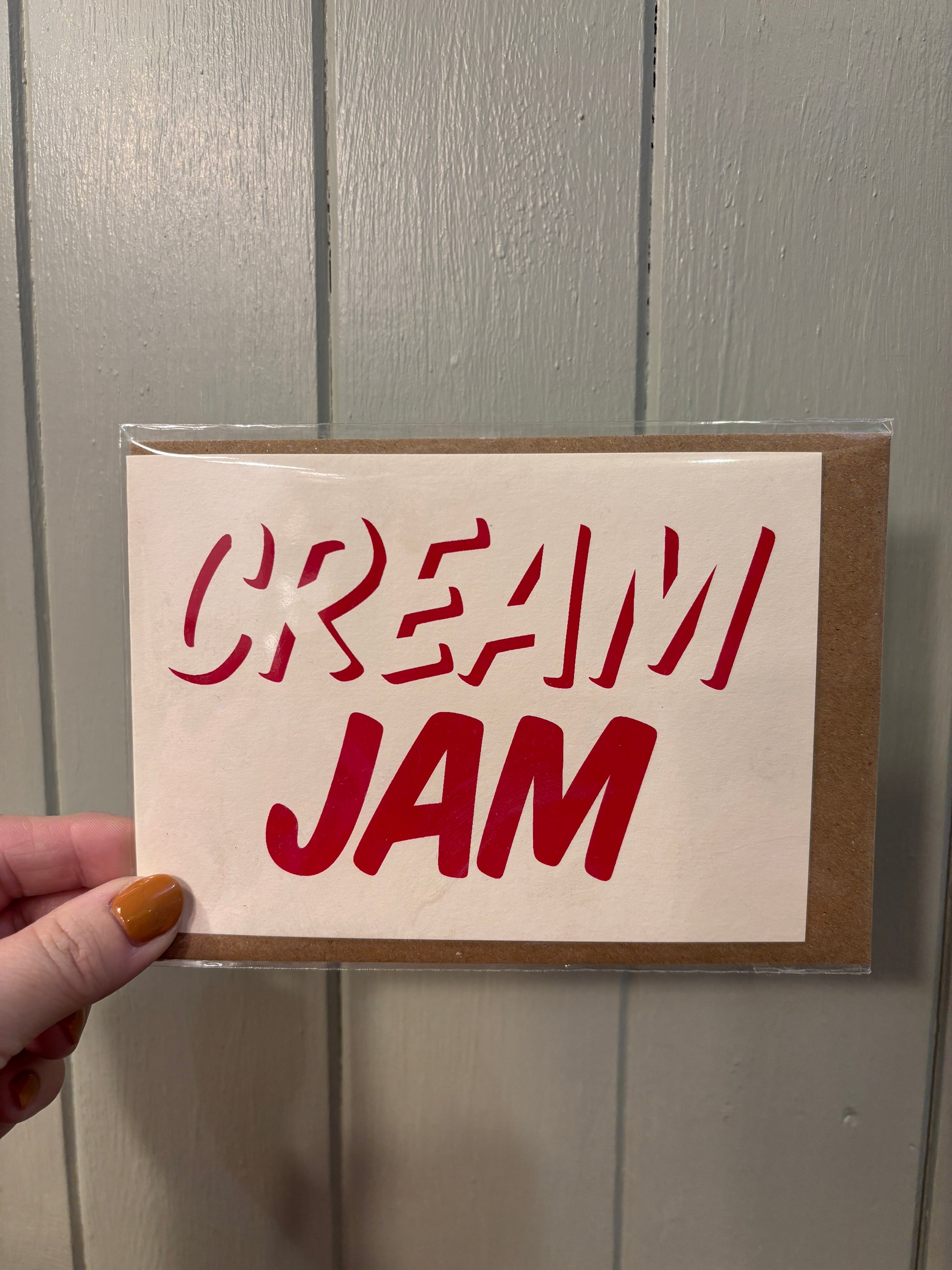 playful foodie greeting card with bold red text—handmade minimalist gift for jam-before-cream fans
