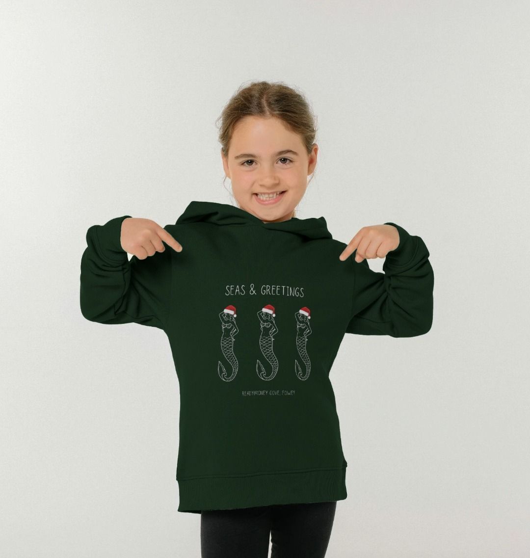 festive kids’ hoodie with “Seas & Greetings” mermaid print—soft, cozy, and perfect for coastal Christmas fun