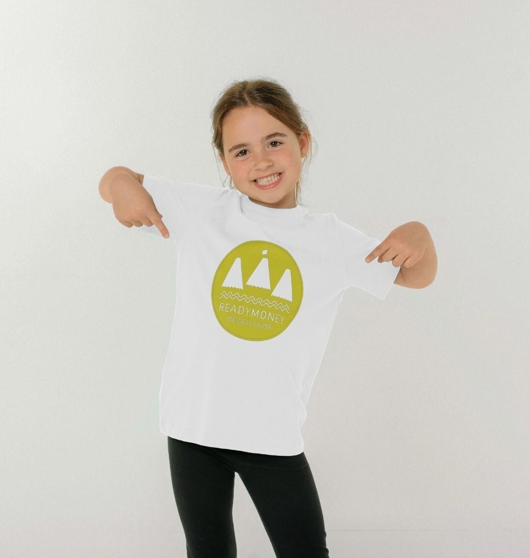 white organic kids’ tee with Readymoney Beach Shop sailboat graphic—playful, breathable, and beach-ready