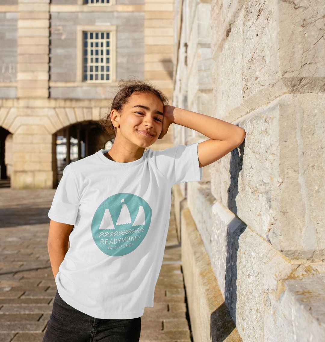 white kids’ organic cotton tee with turquoise Beach Shop print—clean, comfy, and perfect for seaside style