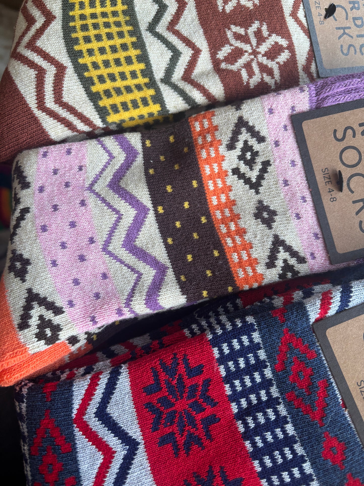 three pairs of colourful striped nordic socks