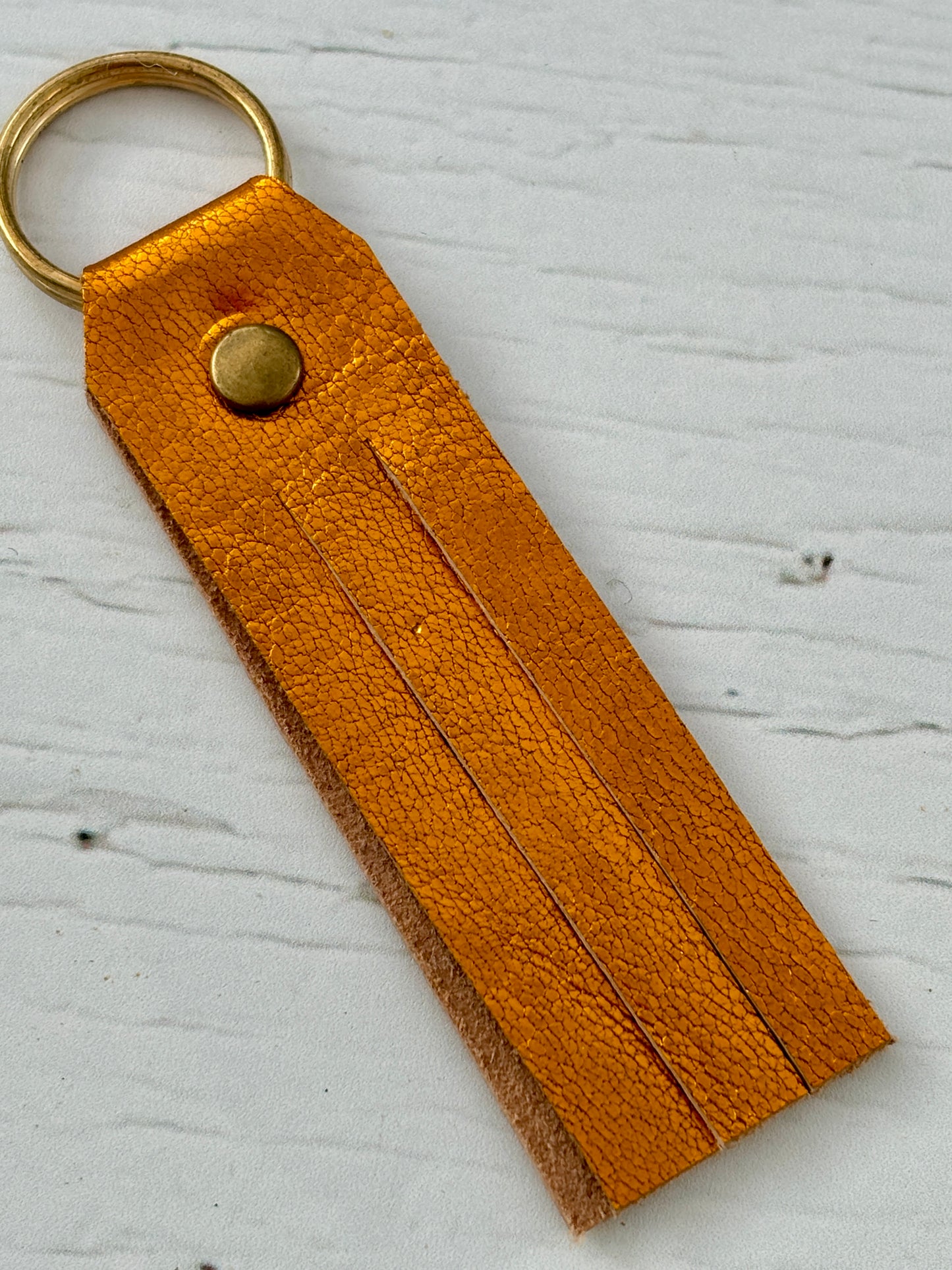 autumn gold key fob—super soft leather offcut with fringe detail, warm-toned, lightweight, and perfect for everyday carry