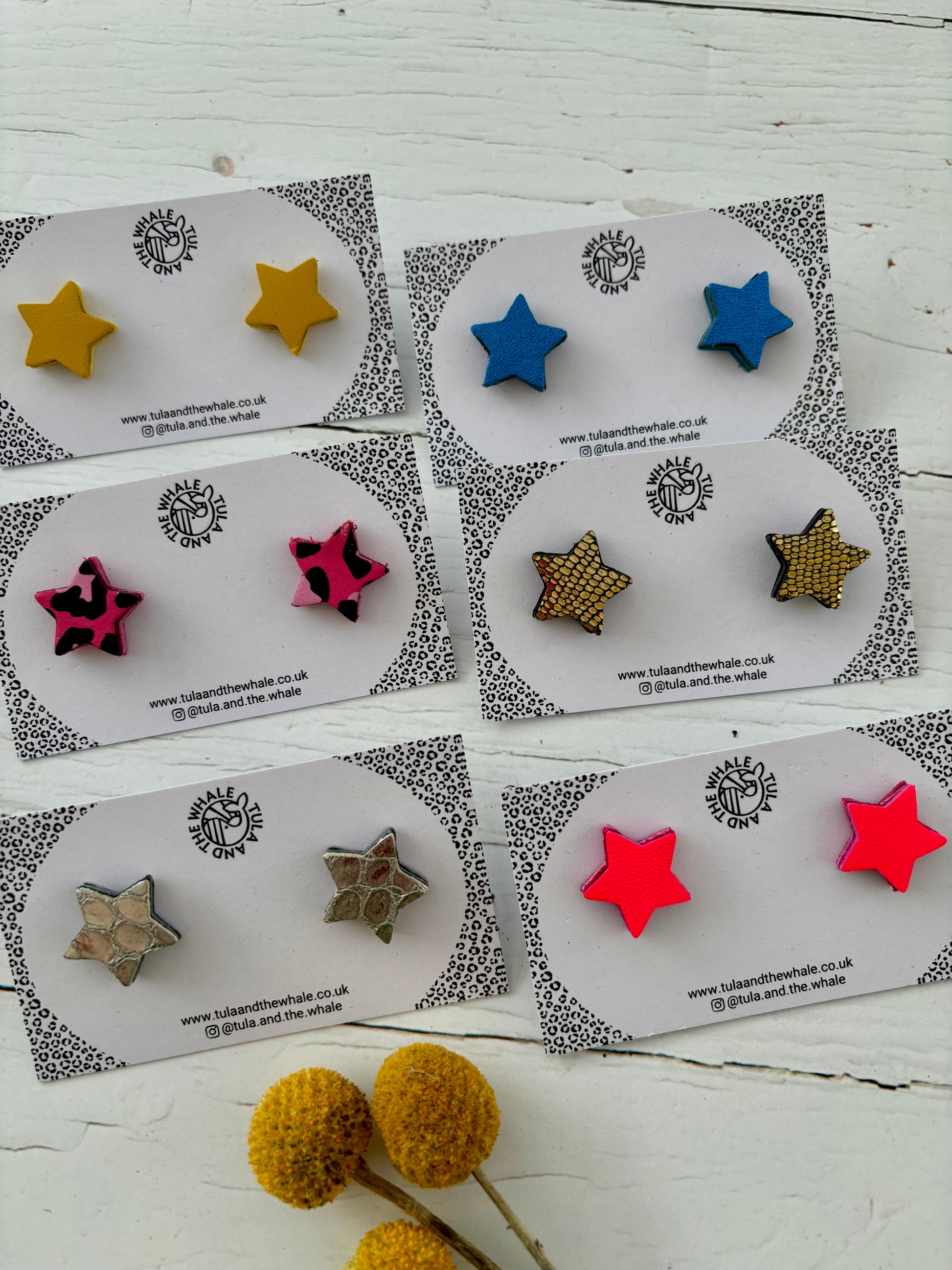 handmade leather star stud earrings in multiple colors - yellow, blue, pink leopard, gold geometric, brown, red - by Tula and the Whale