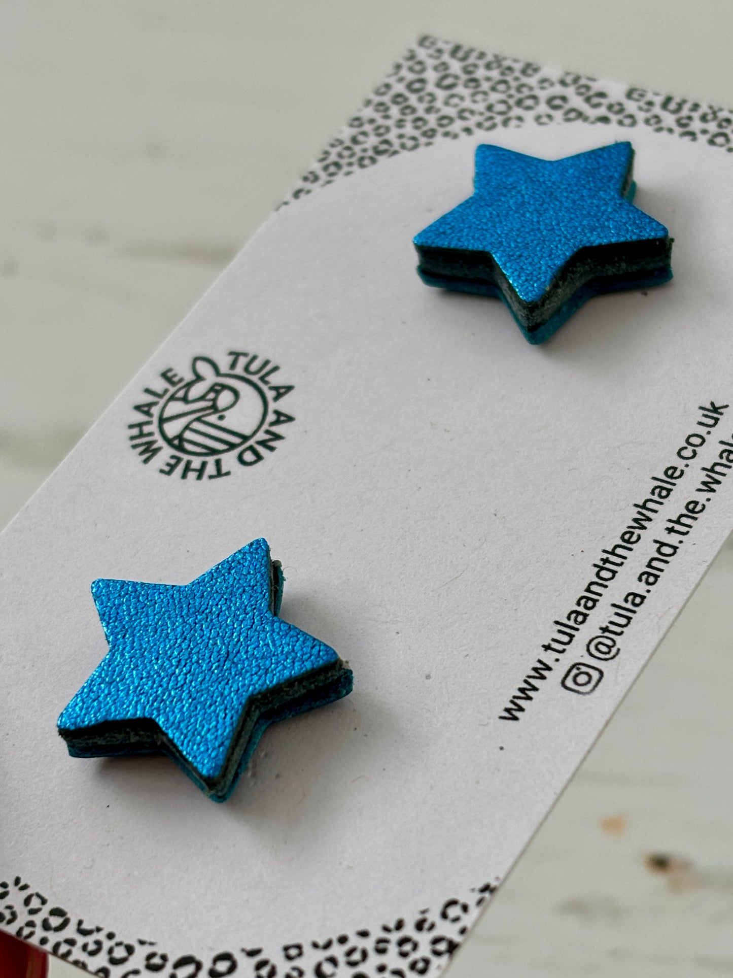 metallic blue leather star stud earrings with black edges - handmade shimmer statement studs by Tula and the Whale
