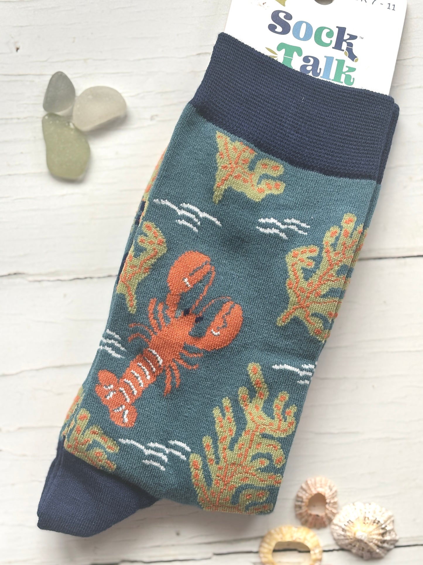 men's bamboo socks by Sock Talk featuring a knitted orange lobster and olive seaweed on a teal background coastal novelty apparel