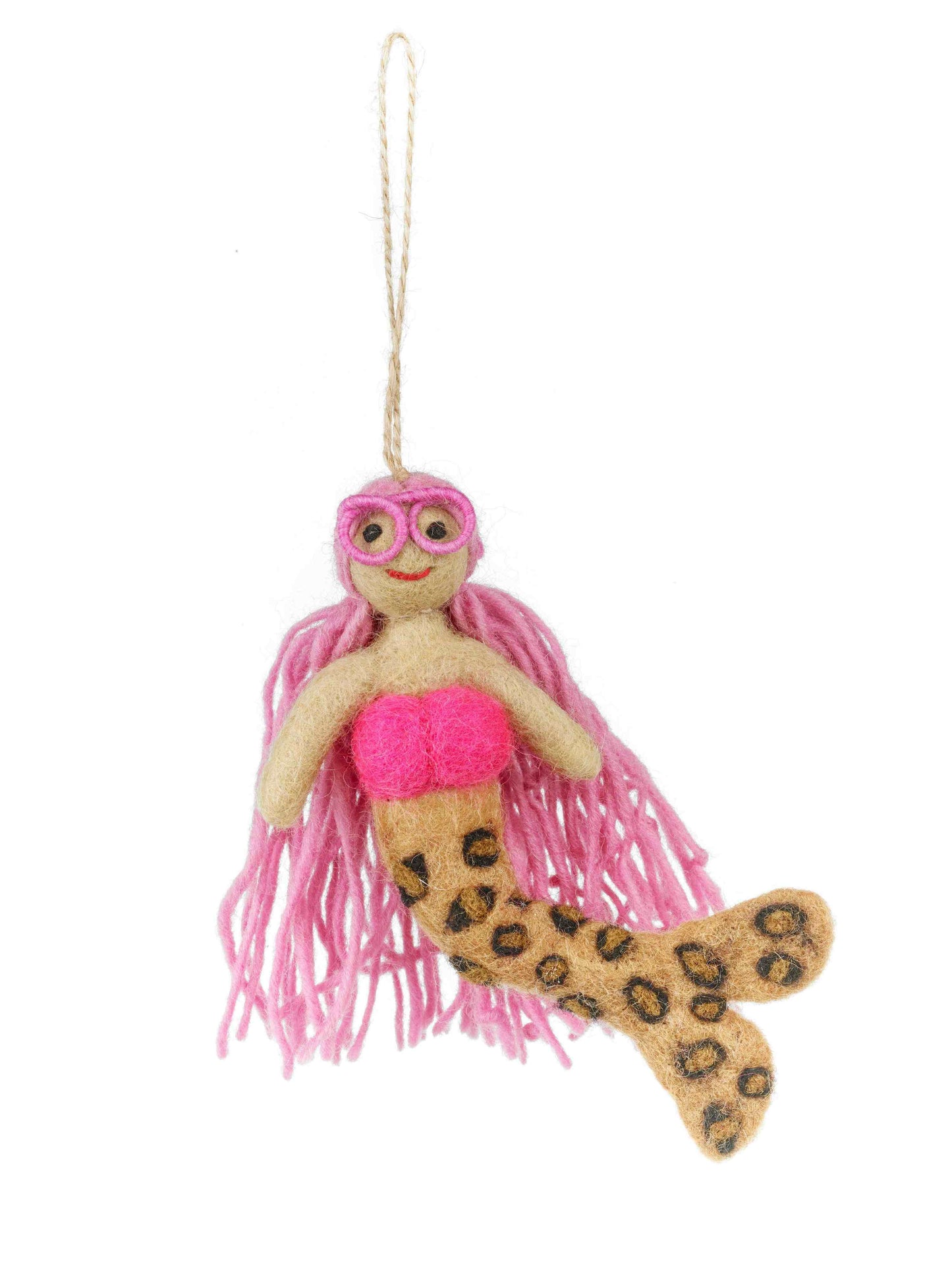 A mermaid felt ornament with long pink hair, a pink top, and a leopard-print tan tail, hanging from a string against a white background.