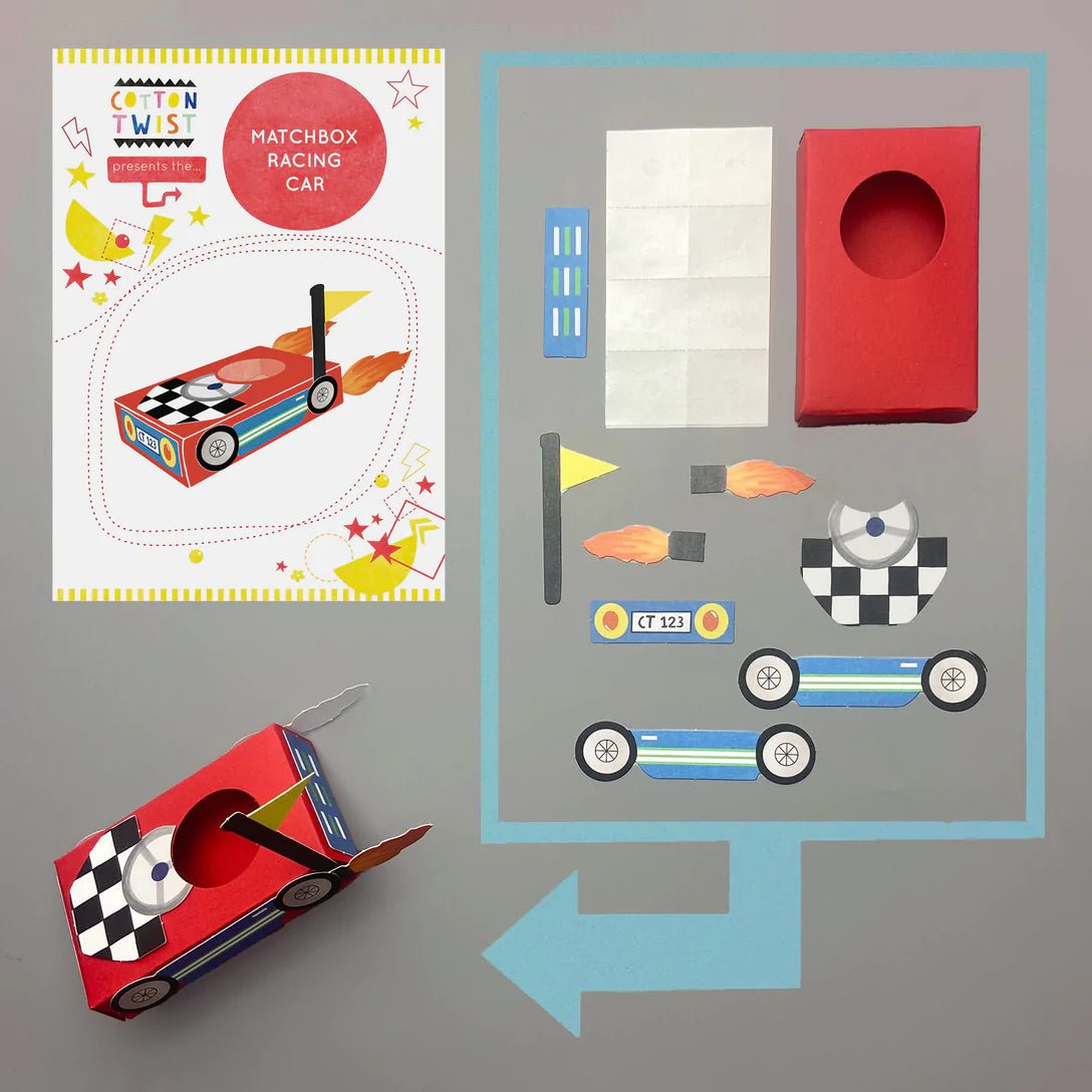 contents of the cotton twist matchbox racing car kit includes red box, car parts, stickers, and assembly pieces for a DIY model car