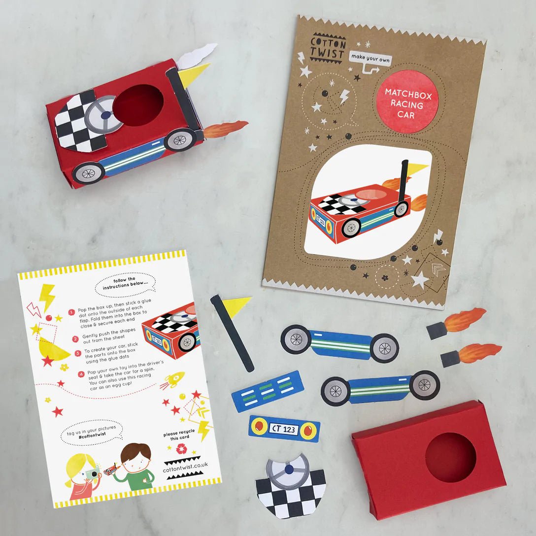 contents of the cotton twist matchbox racing car kit includes DIY instructions, red box, pop-out pieces, wheels, flame stickers, and a flag