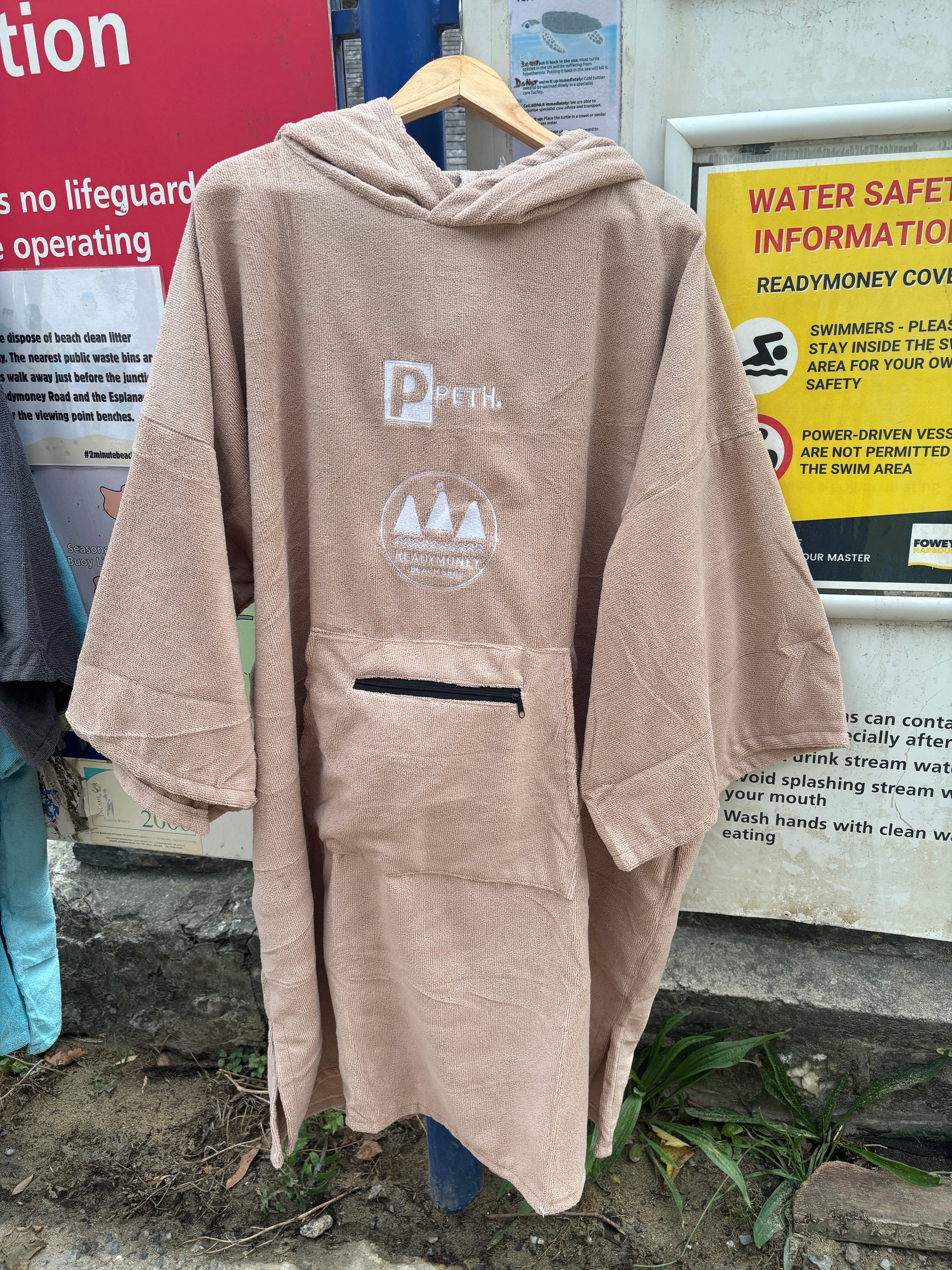 sand-colored Readymoney Cove hooded microfiber robe—soft, quick-dry beach poncho with zip pocket and coastal adventure logo