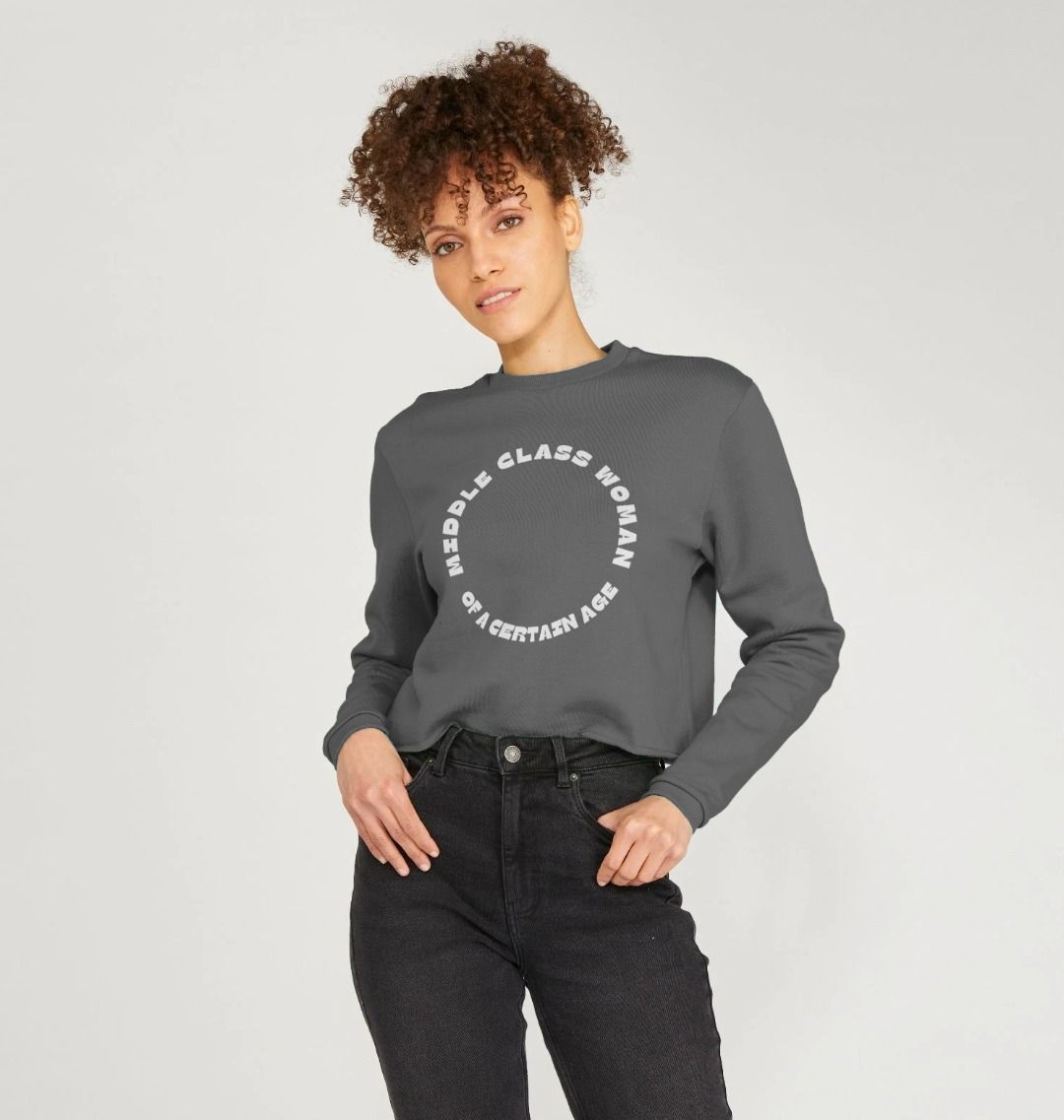 slate grey cropped sweatshirt middle class woman lifestyle, boxy fit casual top, black jeans styling, contemporary wear