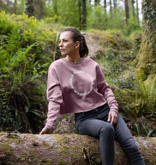 mauve pink cropped sweatshirt forest nature setting, middle class woman slogan jumper, outdoor lifestyle casual fashion