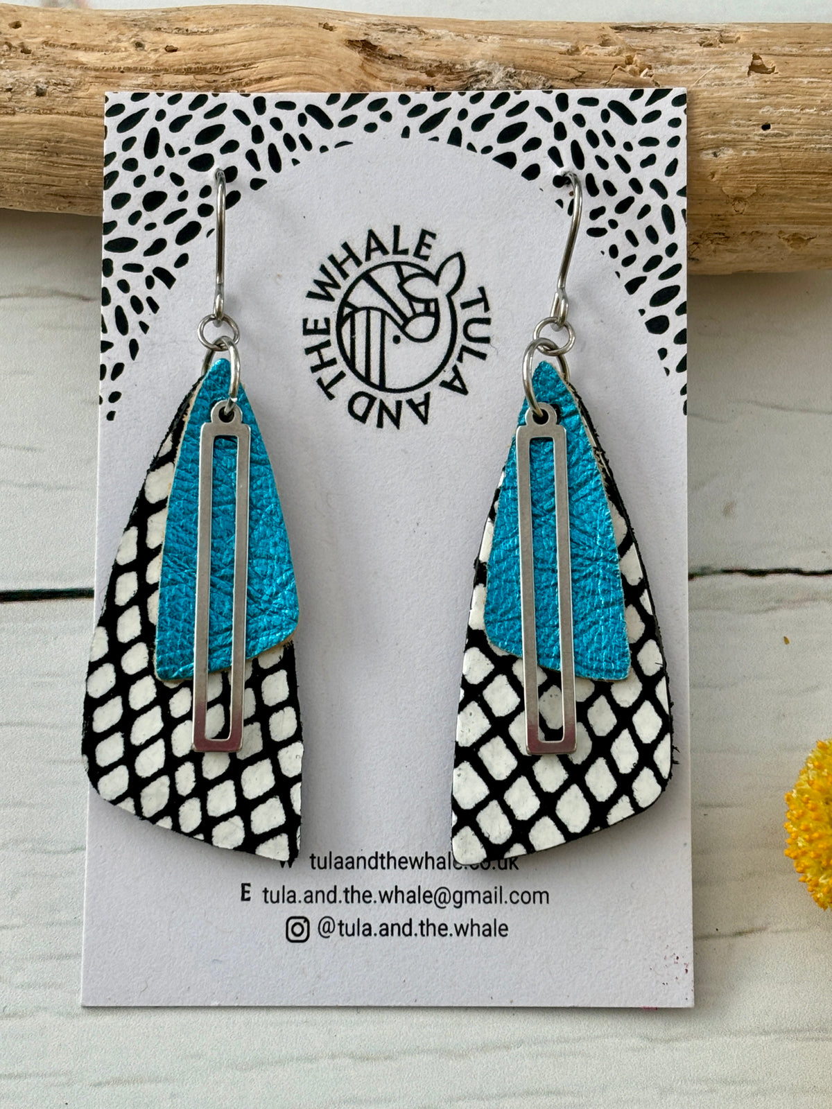 handmade dangly earrings with black-white snake print, turquoise leather, and silver accent—bold, nature-inspired design