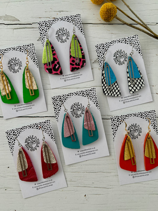 handmade dangly earrings with layered leather in moth-wing shapes—bold, lightweight, and nature-inspired statement jewelry