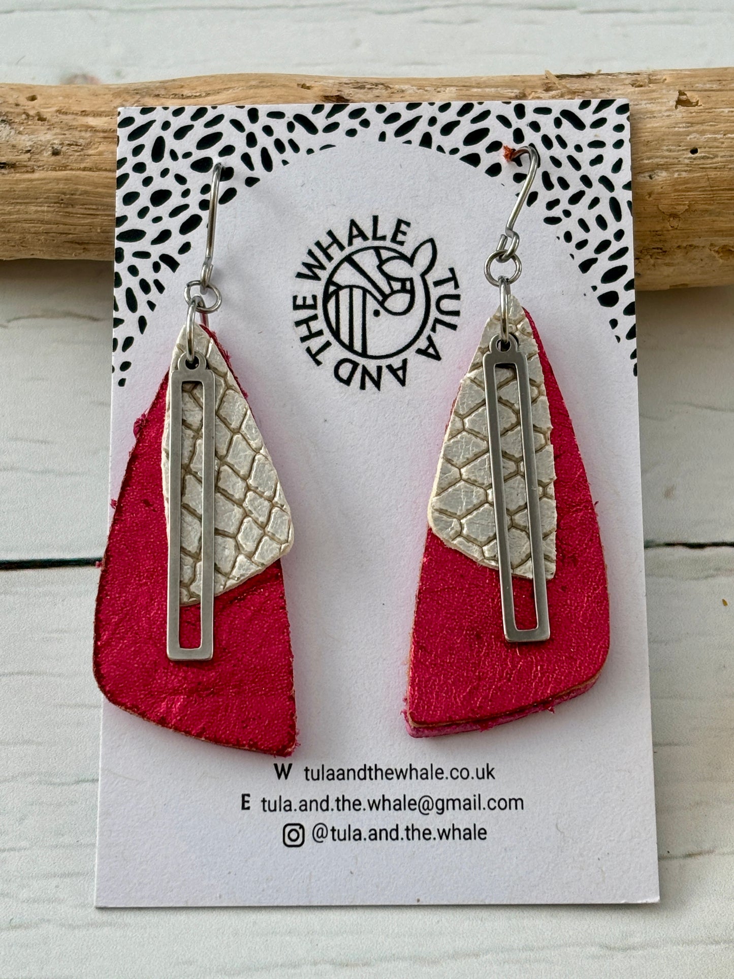 handmade dangly earrings with metallic pink leather, silver snake-textured layer, and geometric accent—bold statement jewelry