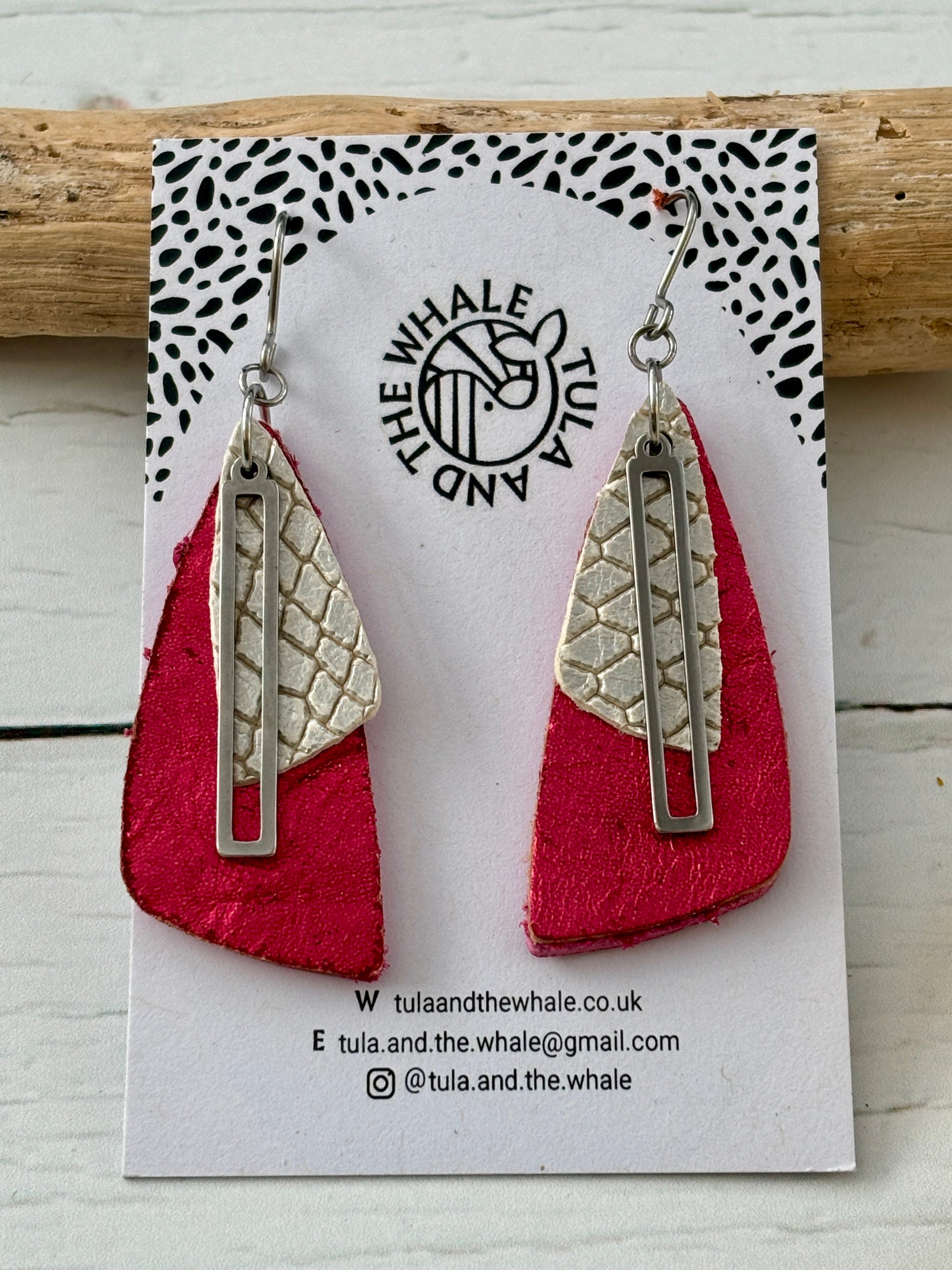 handmade dangly earrings with metallic pink leather, silver snake-textured layer, and geometric accent—bold statement jewelry