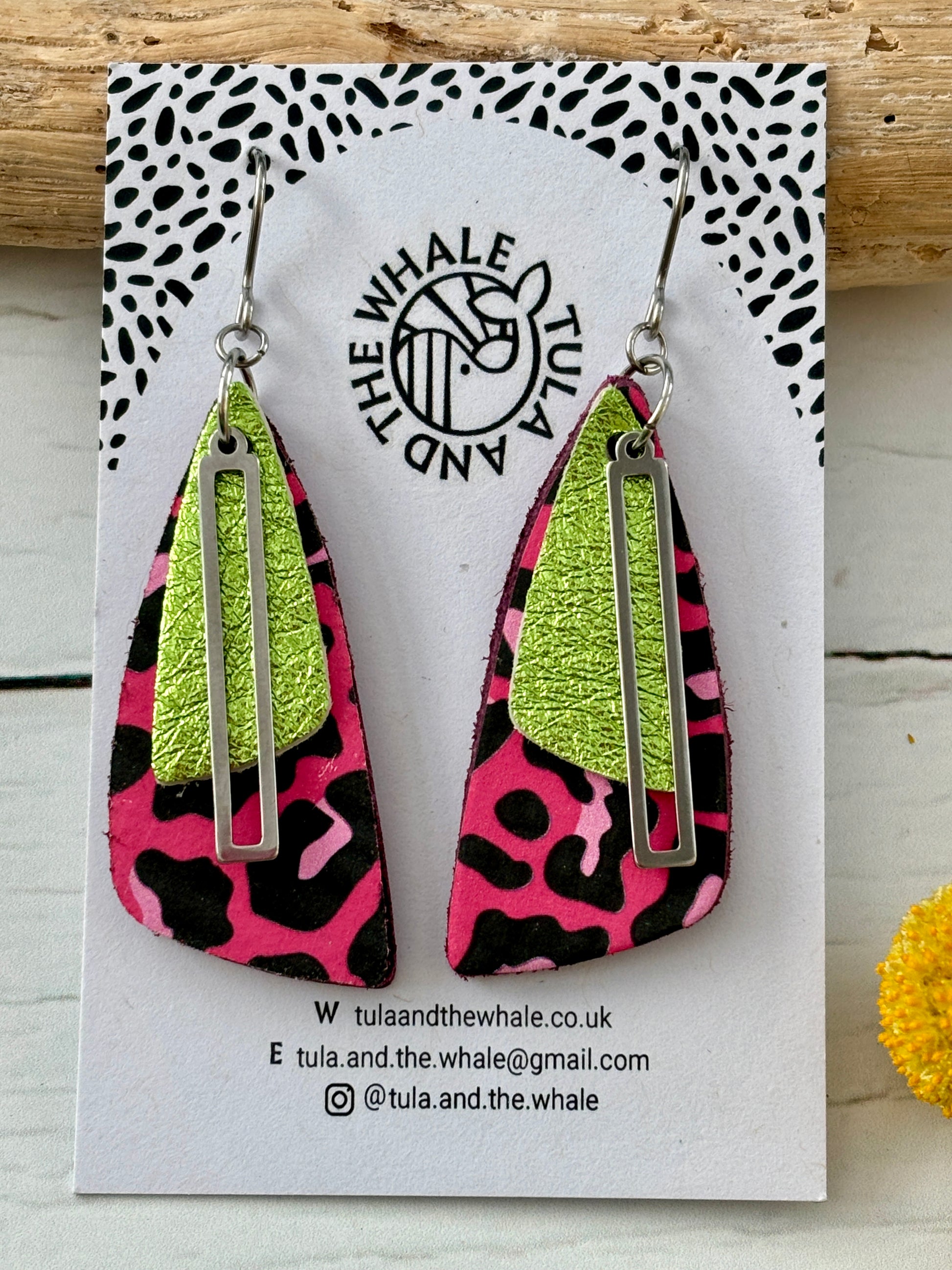 handmade dangly earrings with pink leopard print, lime green leather, and silver accent—bold, nature-inspired statement jewelry