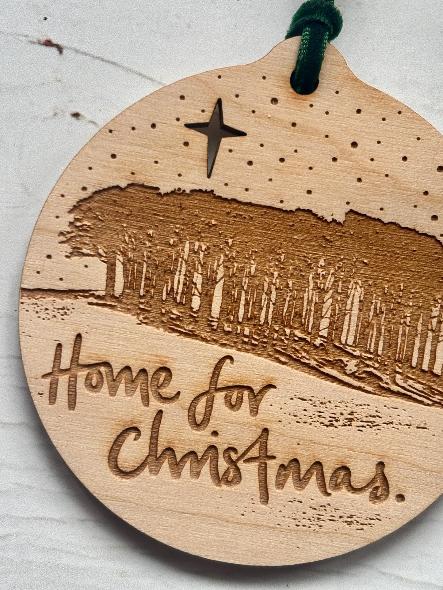closeup shot of handmade 'Nearly Home Trees' Christmas decoration. Cookworthy Knapp landmark, Devon Cornwall border. Nostalgic holiday ornament