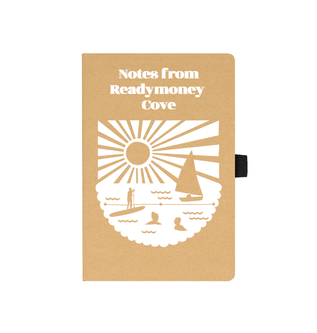 closeup of recycled Readymoney Cove notebook—coastal sun and sea design, eco-friendly travel journal