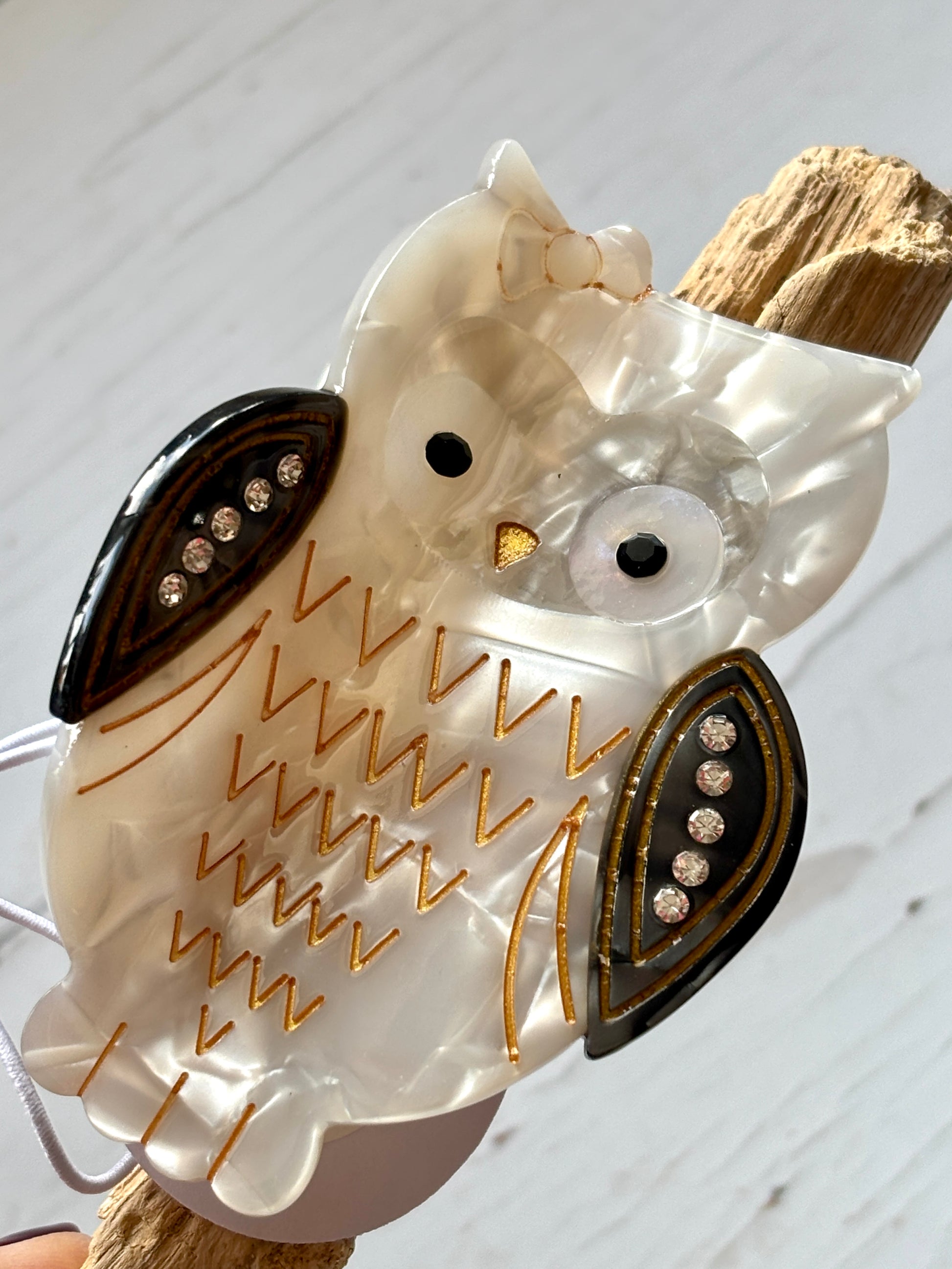 owl hair claw—pearlescent clip with rhinestone wings, golden accents, secure grip, and whimsical woodland-inspired charm