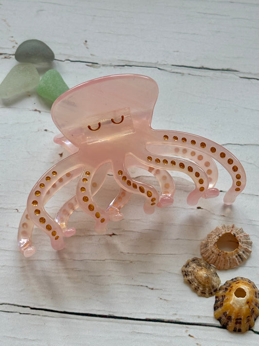 Pale pink octopus hair claw clip with gold glitter spots cute sea animal, resin, nautical, beach-themed summer hair accessory.