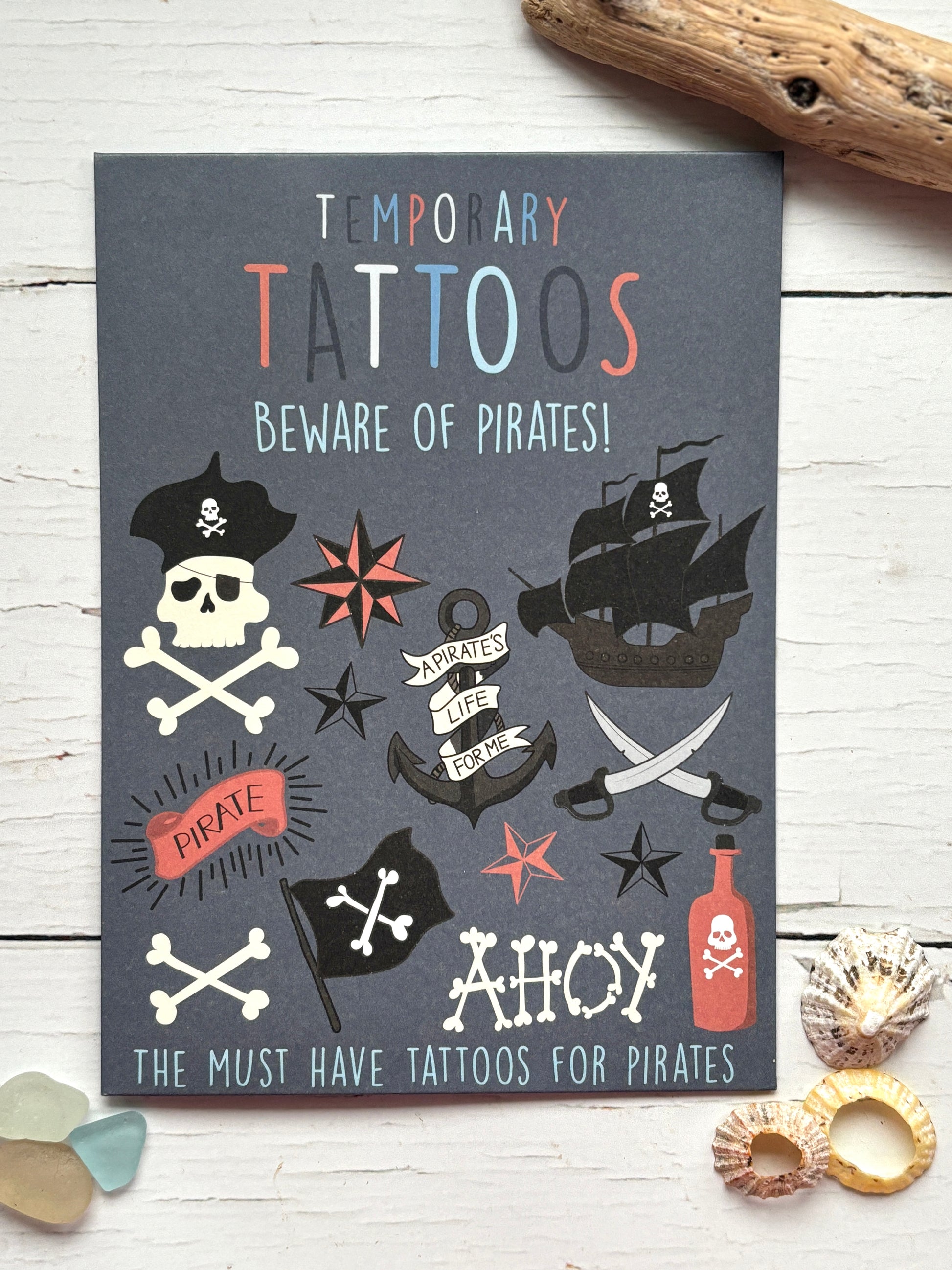 pirate-themed temporary tattoo set with skulls, ships, swords & slogans—perfect for kids' parties or costumes
