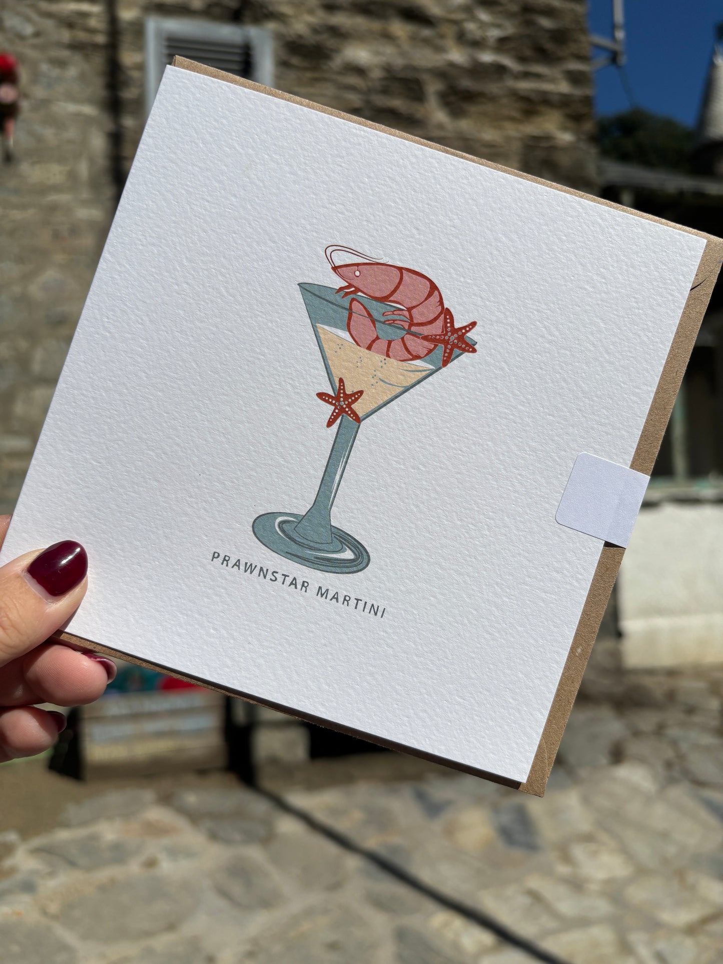 prawnstar Martini greeting card—playful prawn and starfish cocktail art on textured paper, perfect for coastal humor and gifting
