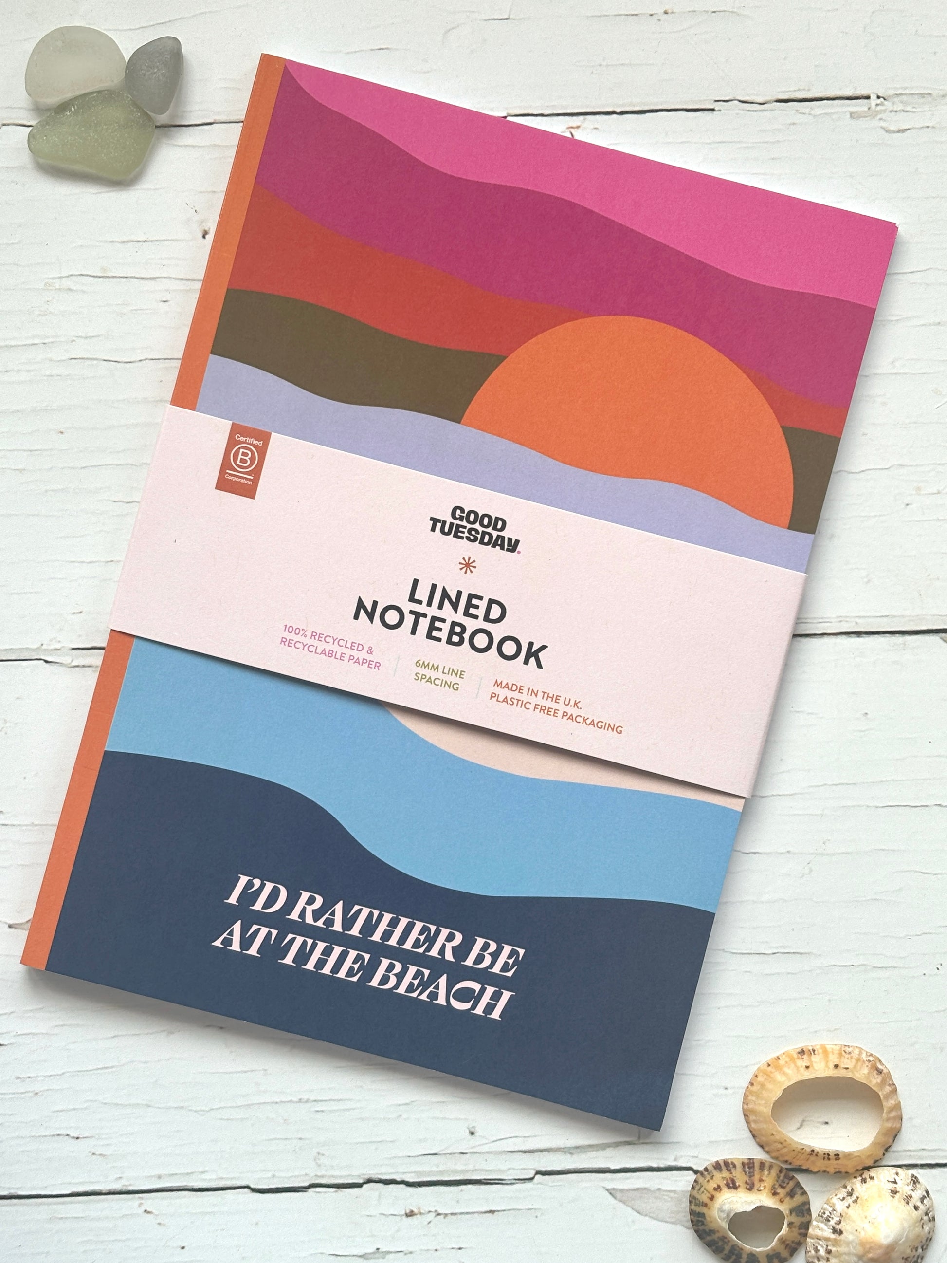 “I’d Rather Be at the Beach” notebook with eco label—sunset wave design on recycled paper, perfect for coastal journaling