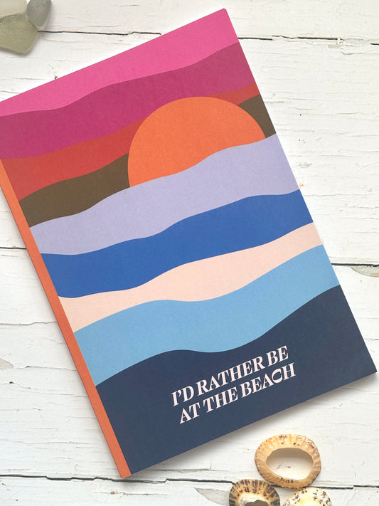 “I’d Rather Be at the Beach” notebook with sunset waves design—coastal-themed stationery for journaling, gifting, or travel lovers
