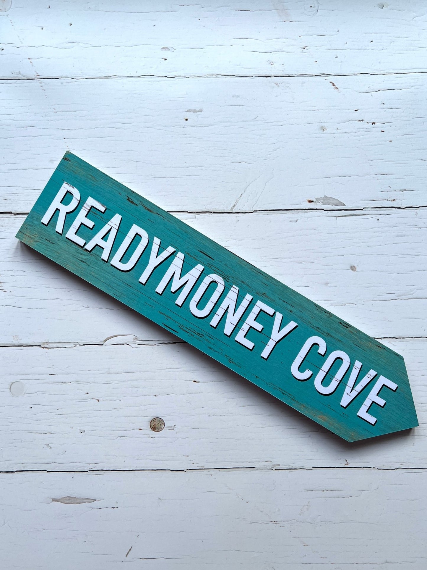 turquoise 'Readymoney Cove' single direction arrow sign coastal beach decor, vintage effect, wooden wall art, nautical theme