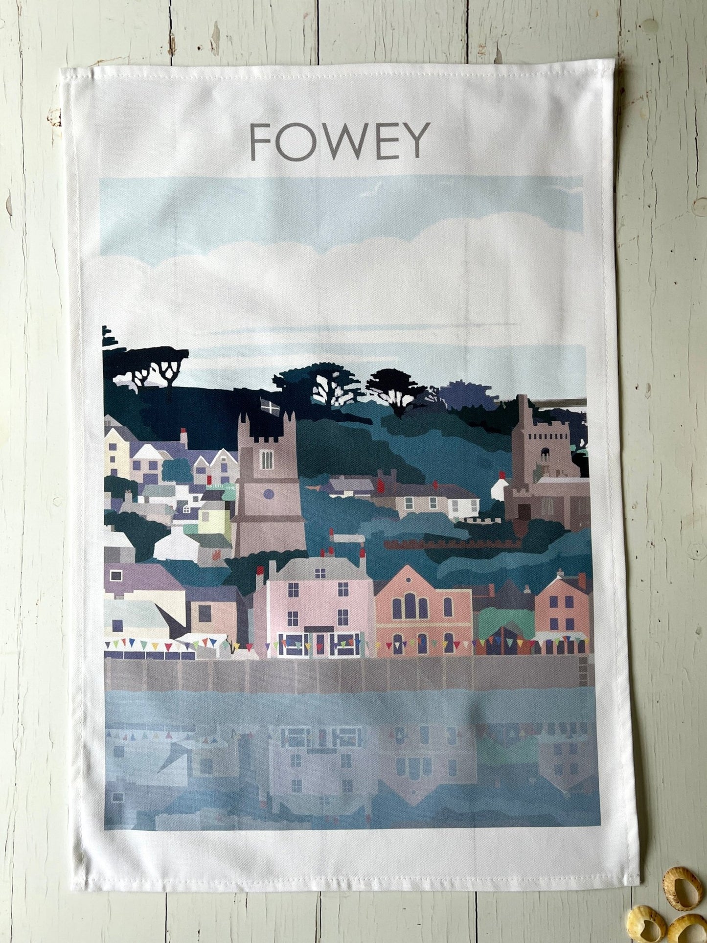 Fowey tea towel—pastel coastal town illustration with church spires, bunting, and waterfront charm for seaside kitchens