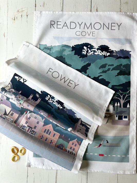 illustrated tea towels—Fowey and Readymoney Cove coastal scenes in soft pastels, perfect for seaside kitchen decor