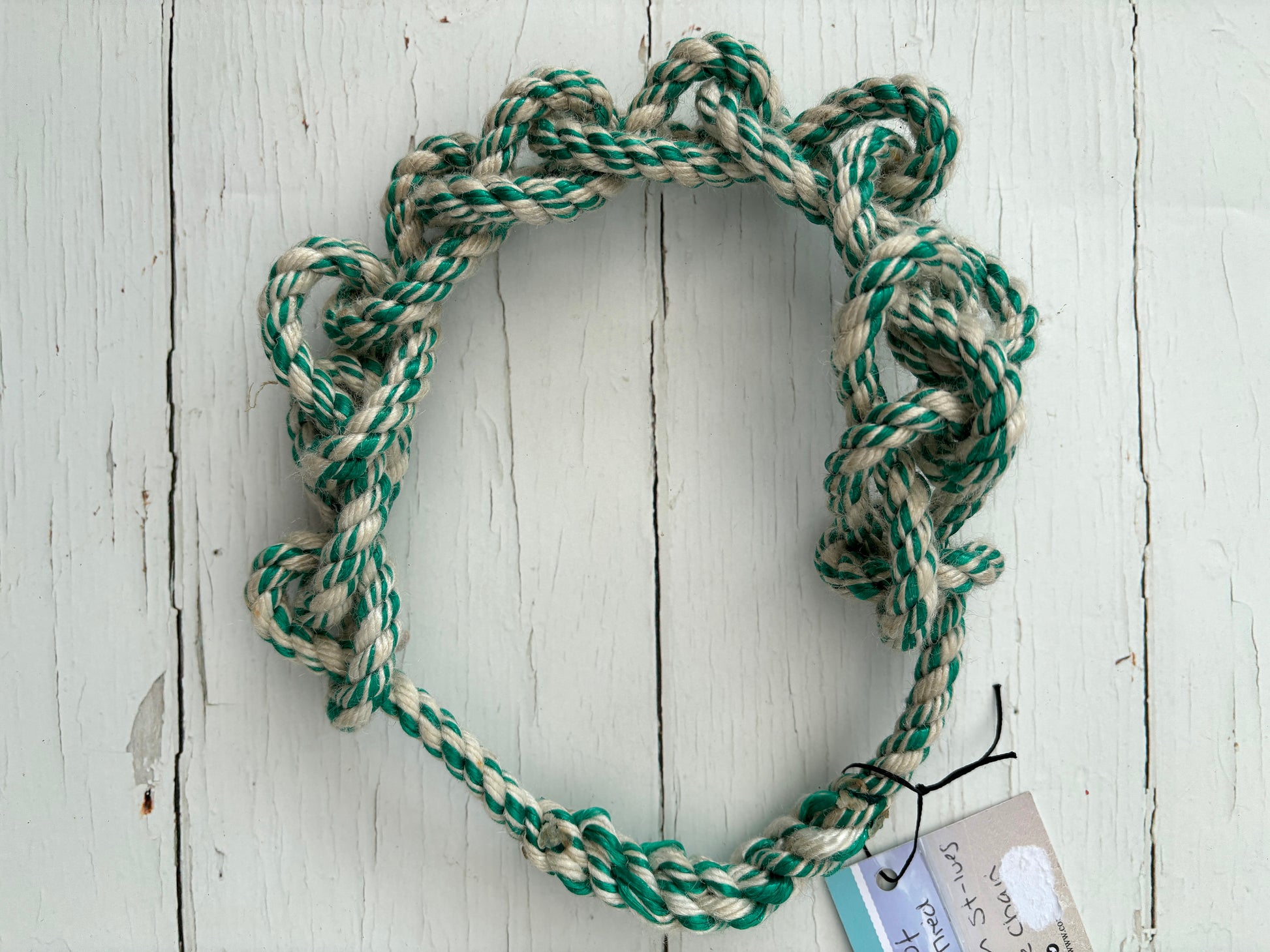 sustainable knotted dog toy hoop made from upcycled green/cream fishing rope tough, eco-friendly fetch ring, seaside pet gift