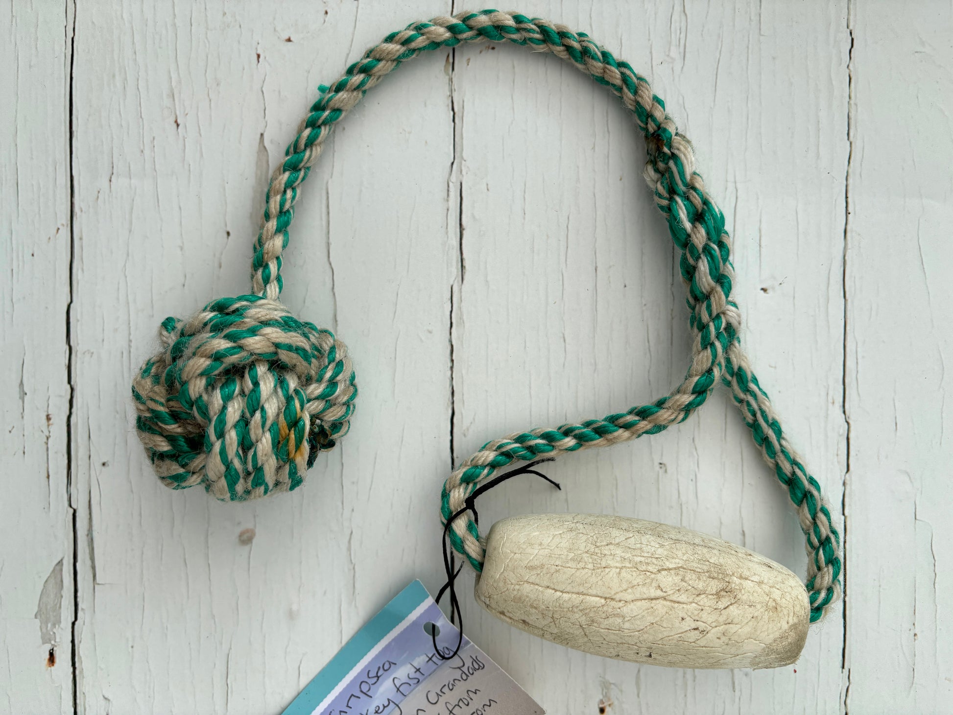 eco-friendly floating dog tug toy made from recycled green/cream fishing rope durable, nautical pet accessory, seaside gift