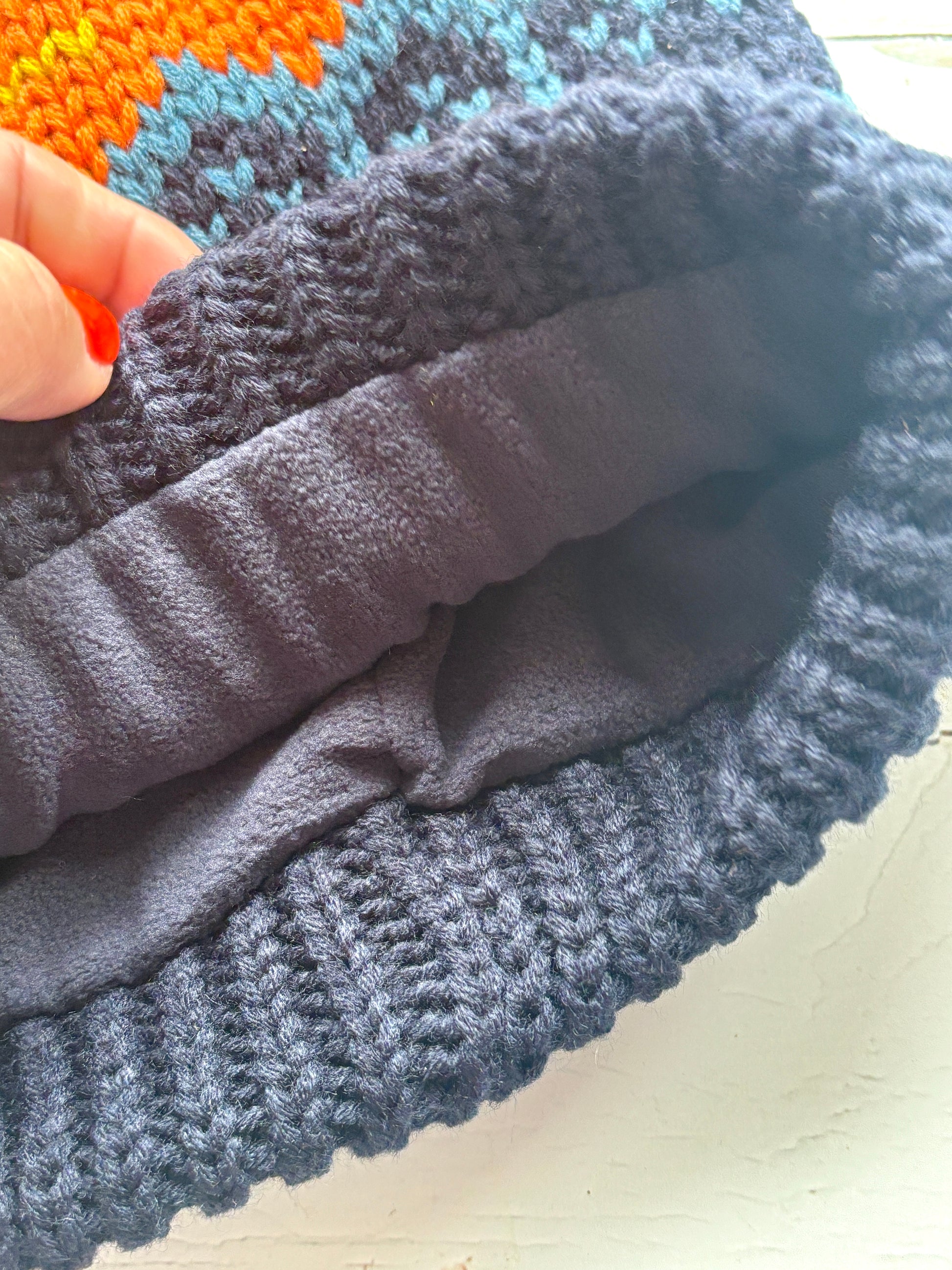 retro knit bobble hat with fleece lining and bold zigzag pattern—ultra-warm winter essential for beachside comfort and style