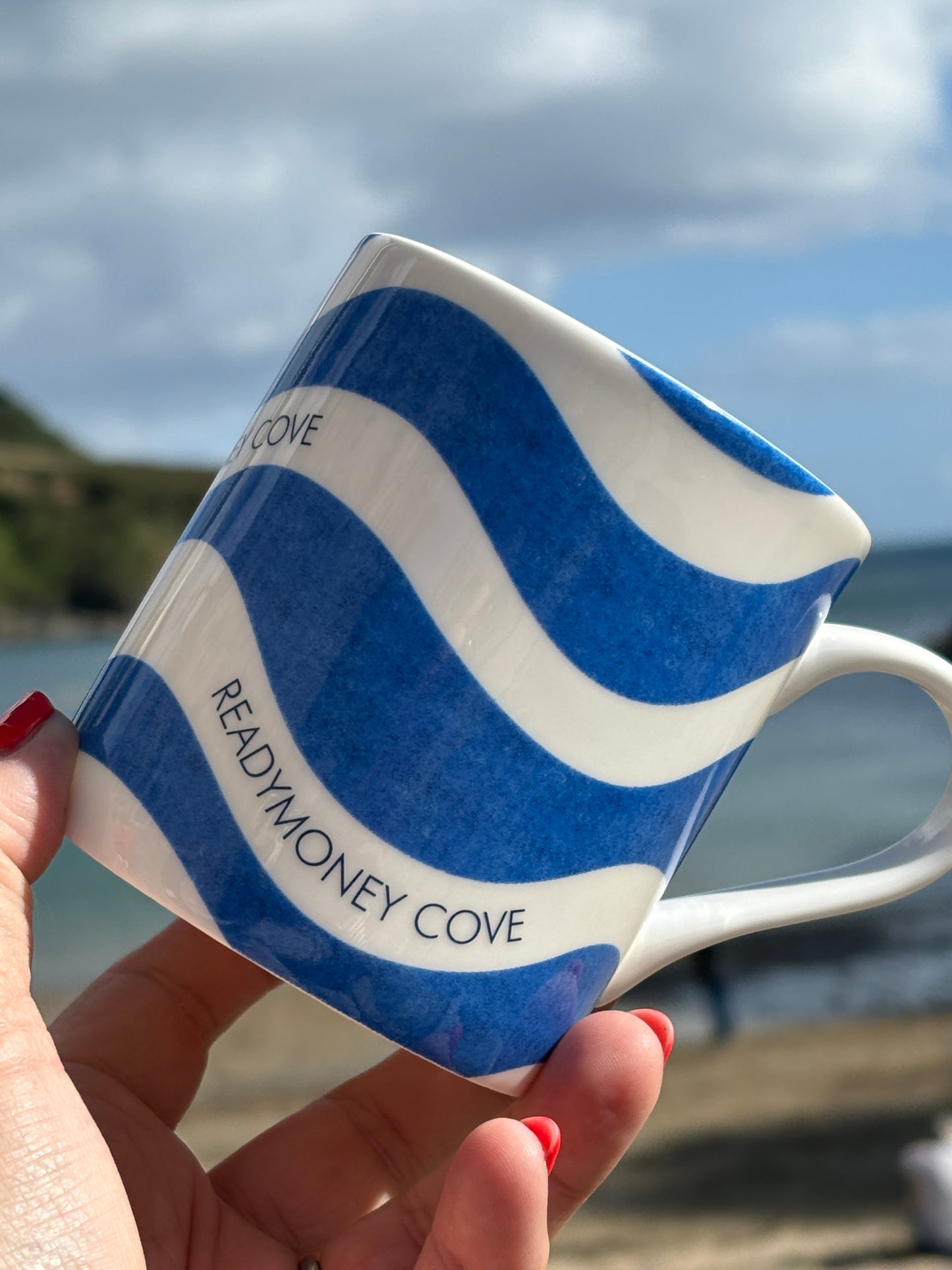 closeup shot of Readymoney Cove bone china mug blue wave design Rick Stein coastal Cornwall ceramic coffee tea drinkware gift