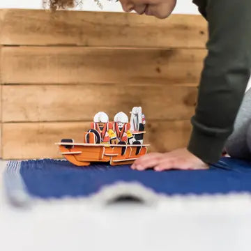 RNLI lifeboat playset lifestyle image child playing rescue boat figures educational building toy maritime roleplay kit