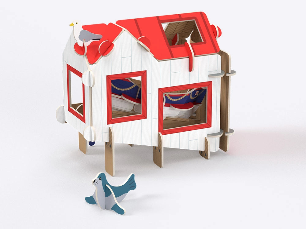 RNLI lifeboat station building playset red roof white walls windows boat inside seal seagull coastal rescue educational toy
