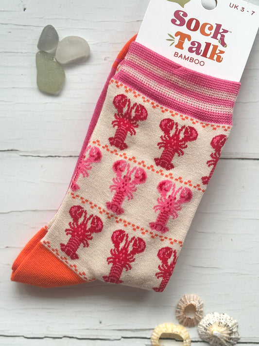 bamboo knit socks by Sock Talk featuring rows of pink and red lobsters bright orange accents make a unique coastal gift