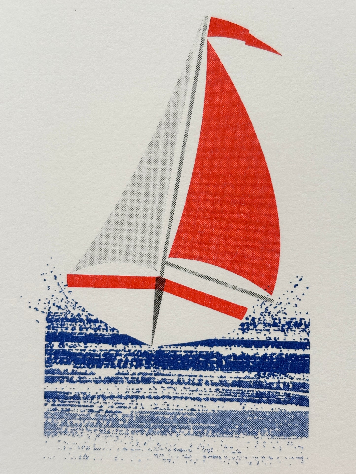 closeup shot of red sailboat mini card with nautical illustration, ocean-themed blank stationery for coastal gifting