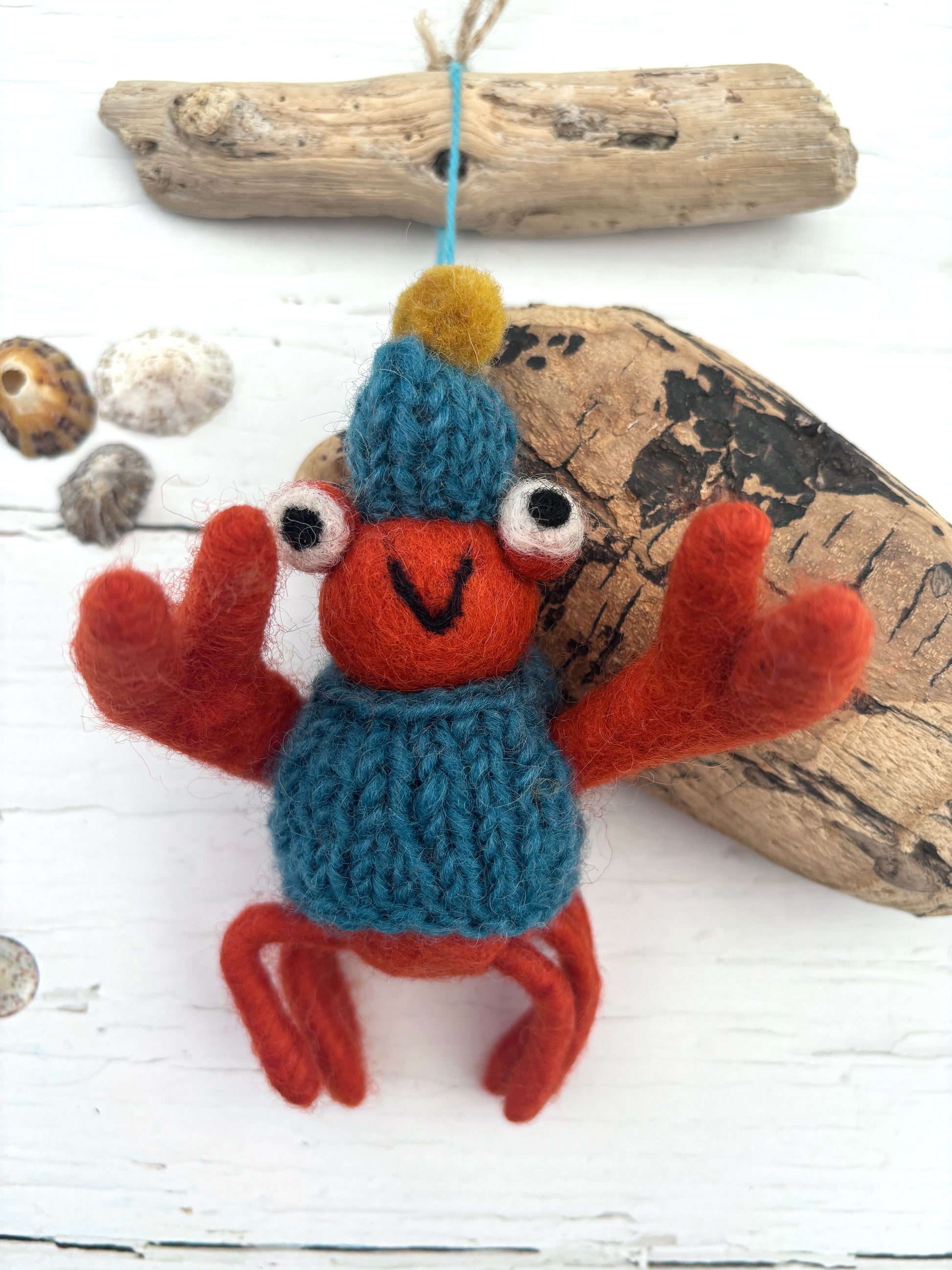 hand-felted red crab ornament with knit hat and sweater, coastal-themed decor for beachy holiday styling