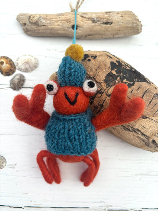 hand-felted red crab ornament with knit hat and sweater, coastal-themed decor for beachy holiday styling