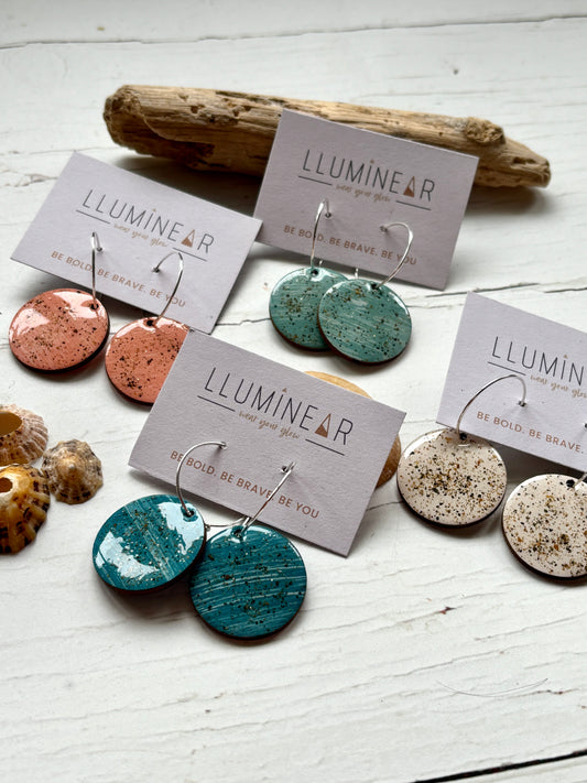 sterling silver hoop earrings with sand-textured resin in turquoise, peach, and cream coastal-inspired, handmade fashion jewelry