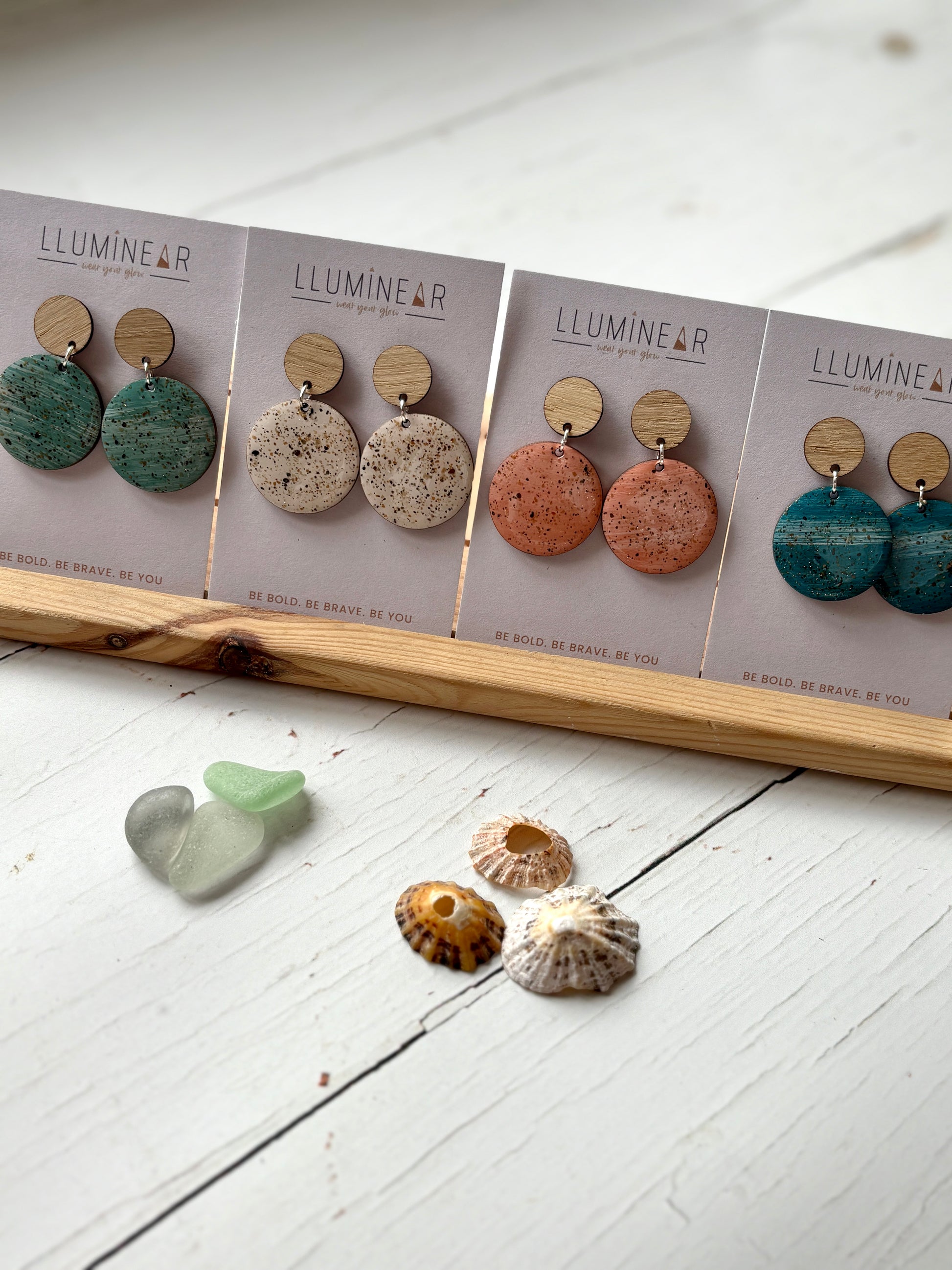 sterling silver stud earrings with wood top handmade sand-texture resin in cream, peach, and teal coastal, modern jewelry
