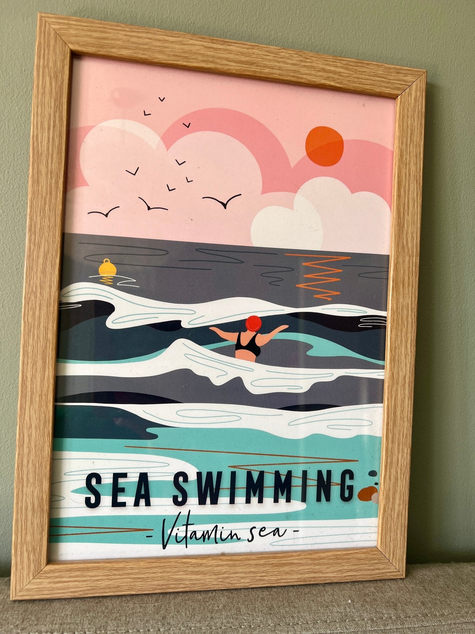 framed A4 coastal print with swimmer, sunset sea, and “Vitamin Sea” quote—perfect ocean-inspired wall art