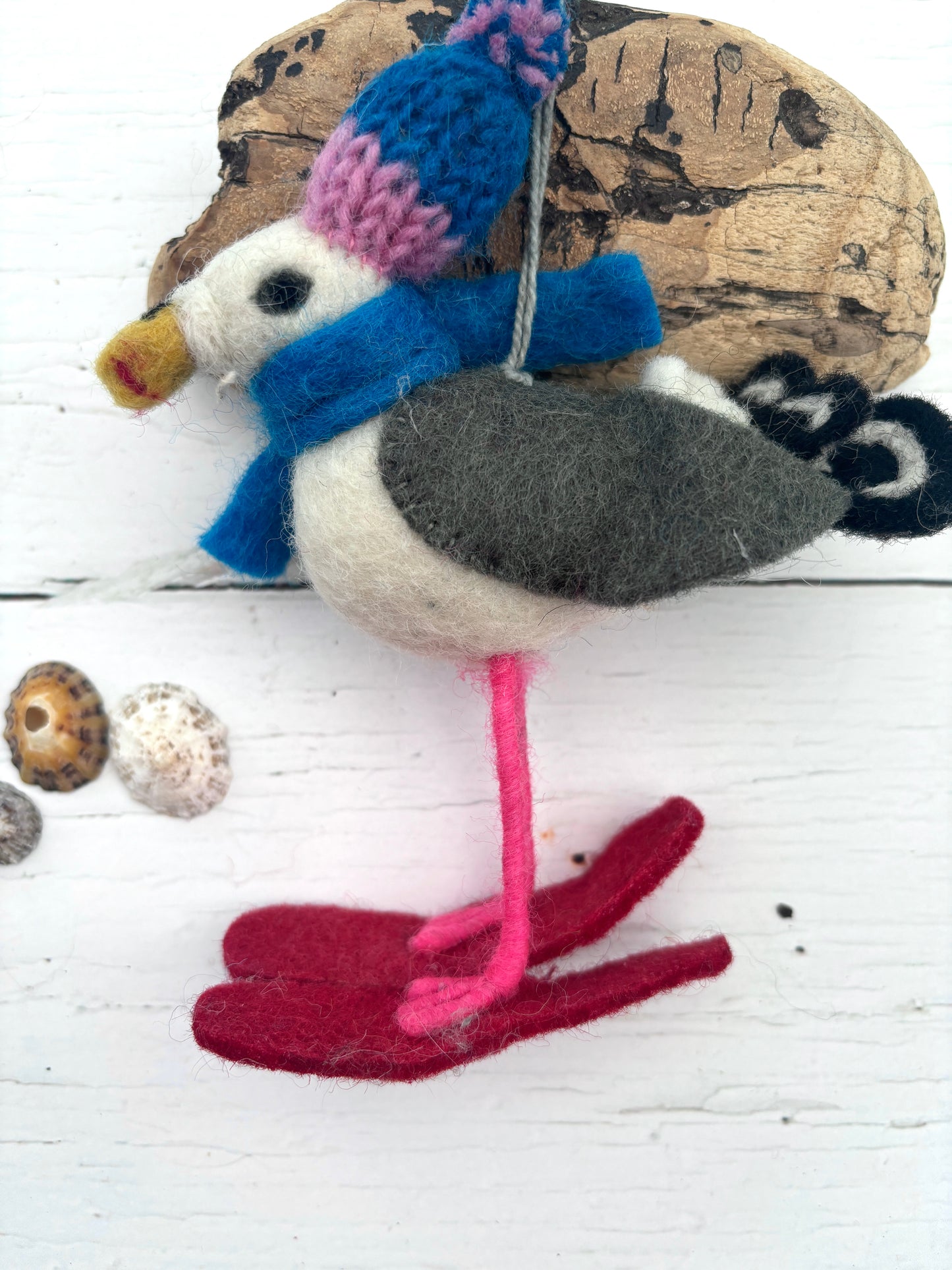 hand-felted seagull Christmas ornament with skis, knit hat, and scarf—whimsical coastal winter holiday decor