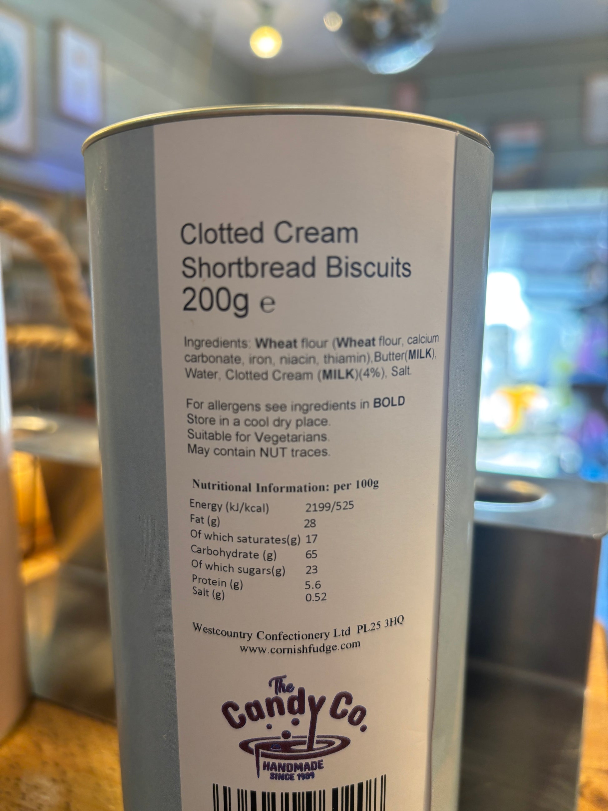 clotted cream shortbread gift tin with nutrition label—rich, buttery biscuits made with milk, wheat, and recycled packaging