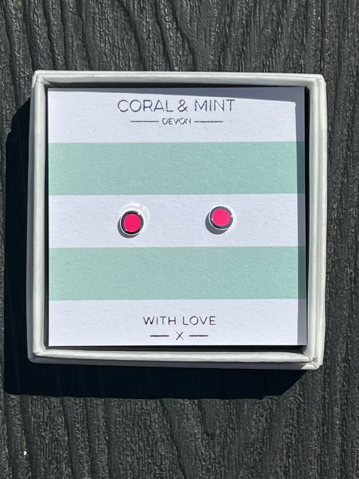hot pink enamel dot stud earrings by Coral & Mint minimalist silver jewelry on a striped gift card dainty gift idea