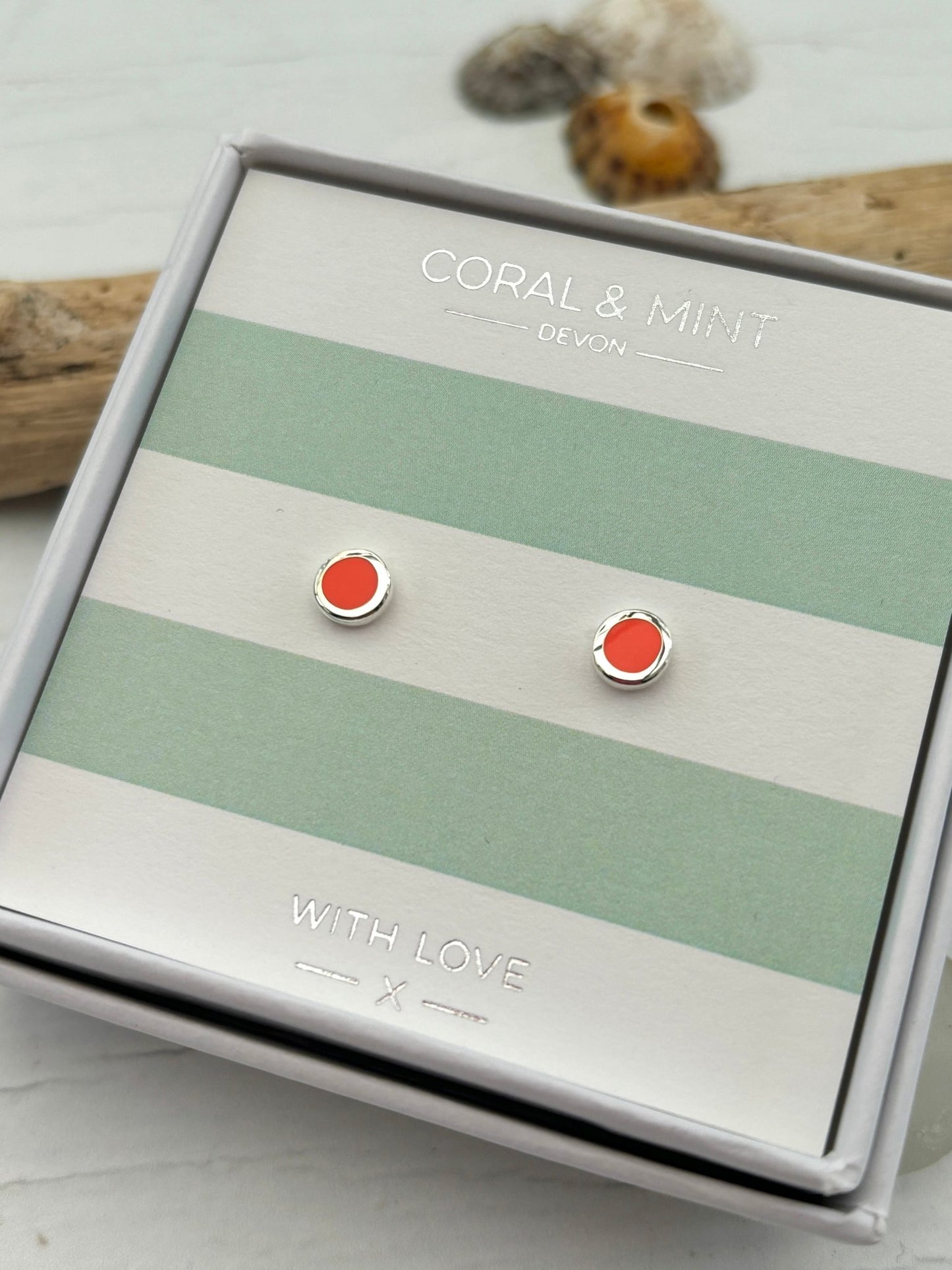 neon coral enamel dot stud earrings by Coral & Mint minimalist silver jewelry on striped gift card vibrant gift idea
