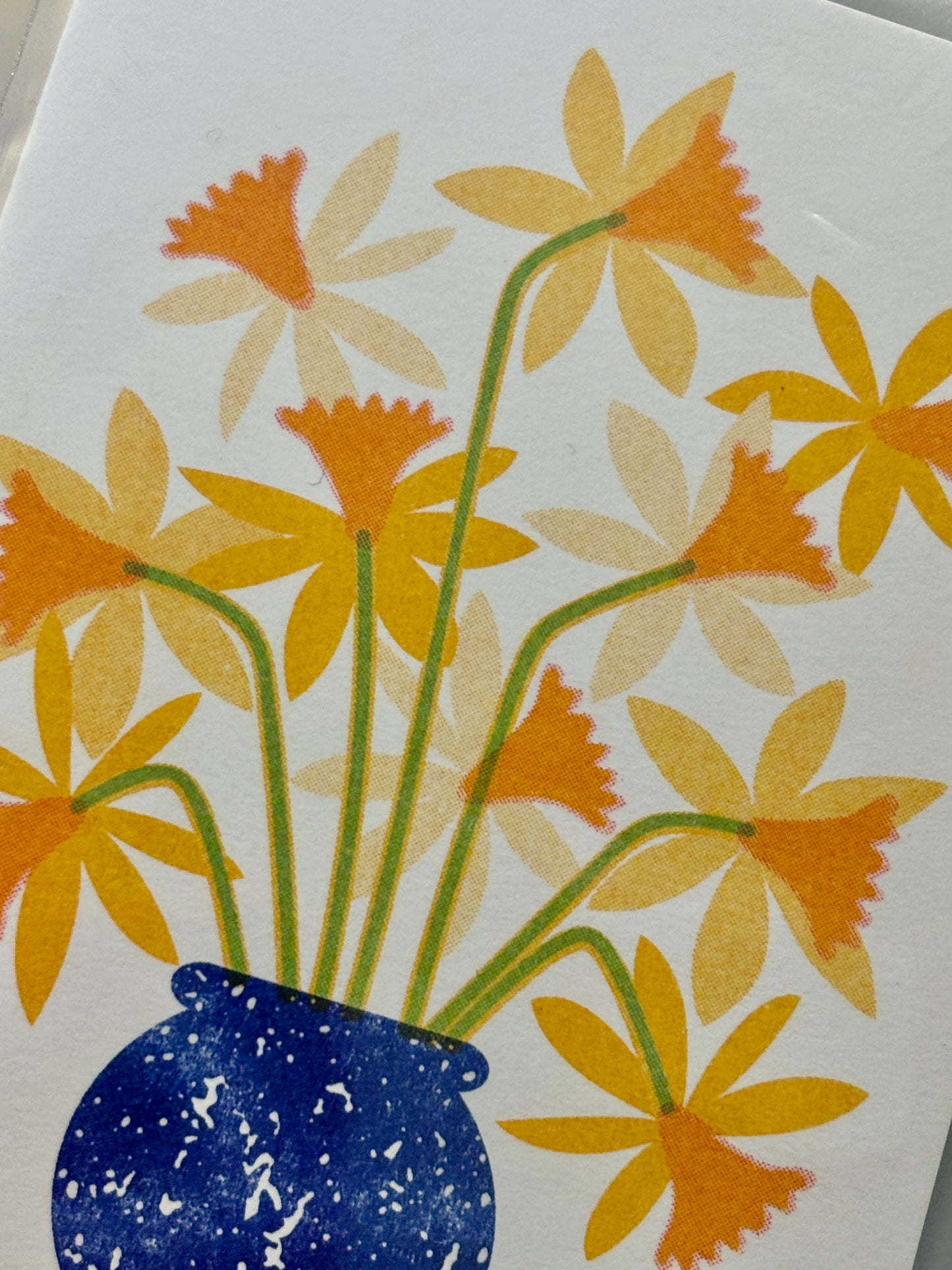 closeup shot of daffodils in blue vase—bright spring mini card with layered floral design for cheerful notes
